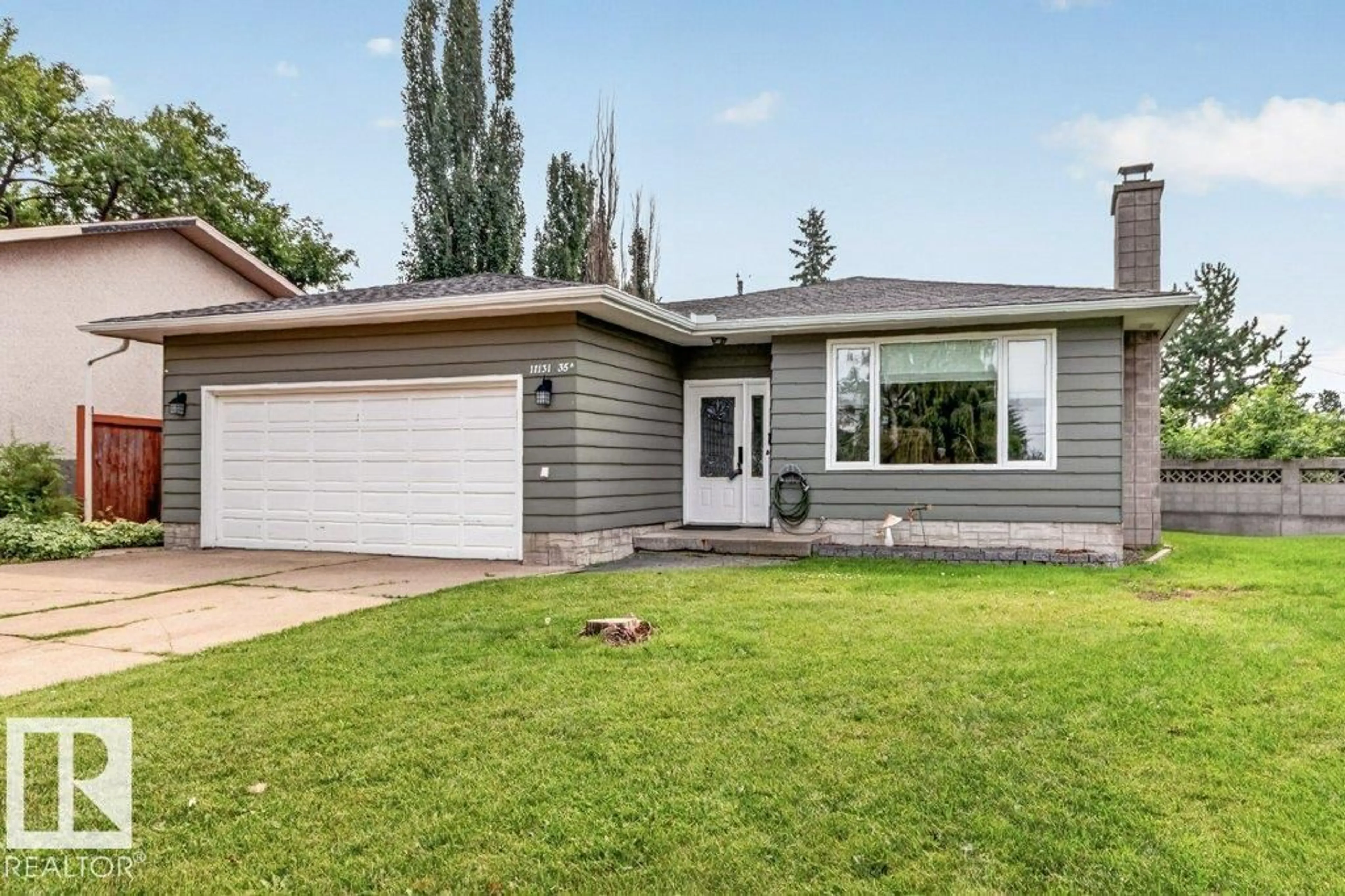 Home with vinyl exterior material, street for 11131 35A AV, Edmonton Alberta T6J0A4