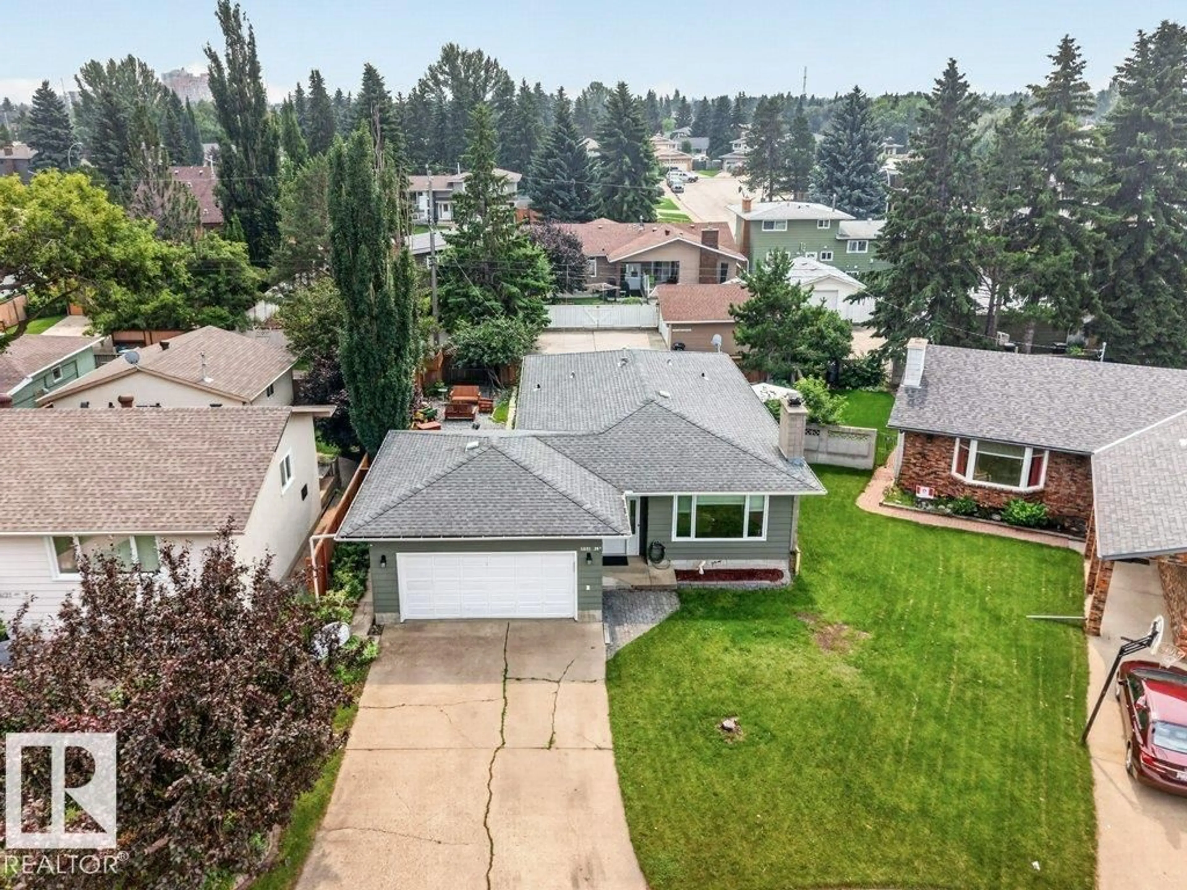 A pic from outside/outdoor area/front of a property/back of a property/a pic from drone, water/lake/river/ocean view for 11131 35A AV, Edmonton Alberta T6J0A4