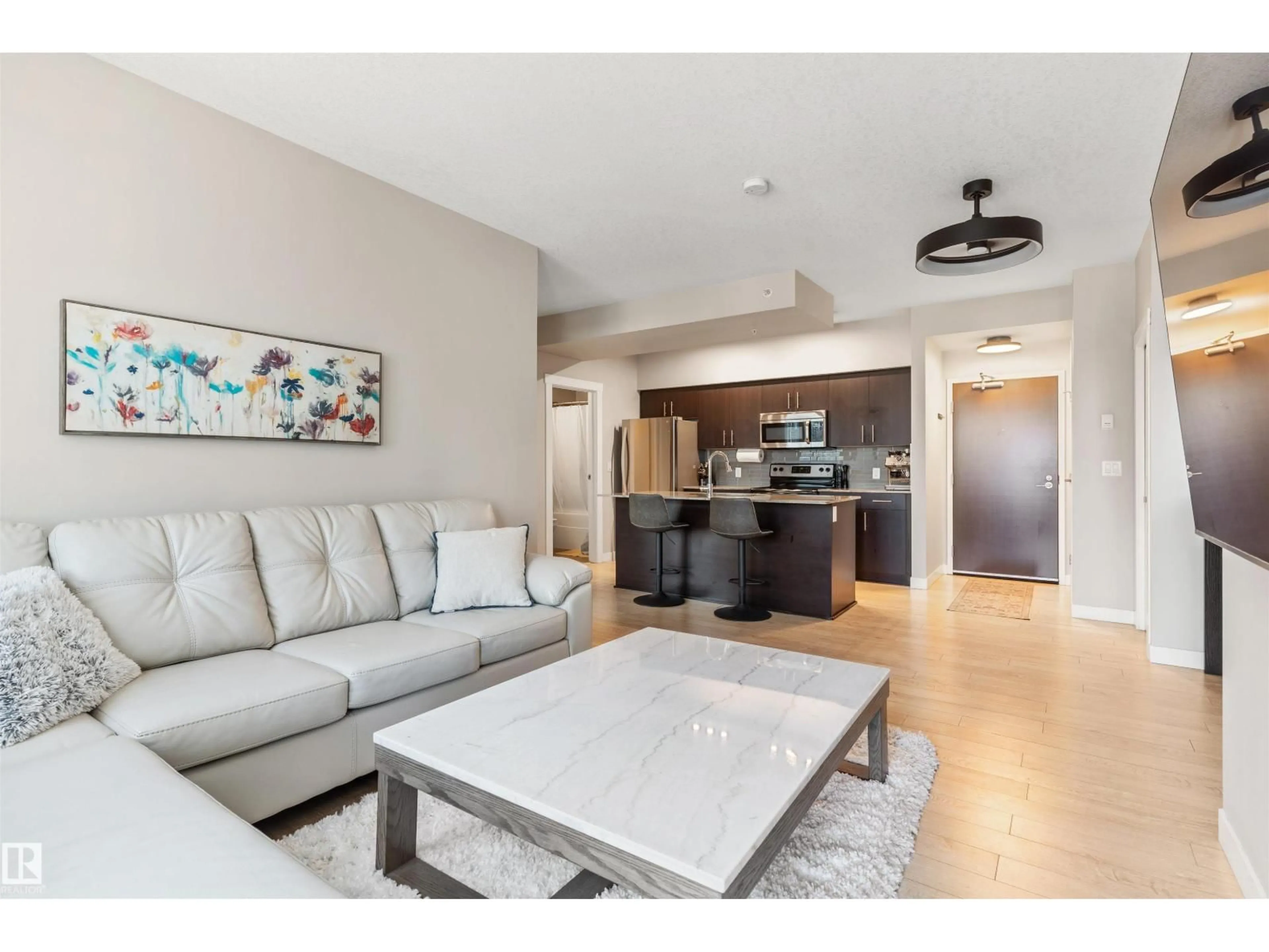 Living room with furniture, ceramic/tile floor for 10226 - 2205 104 ST, Edmonton Alberta T5J1B8