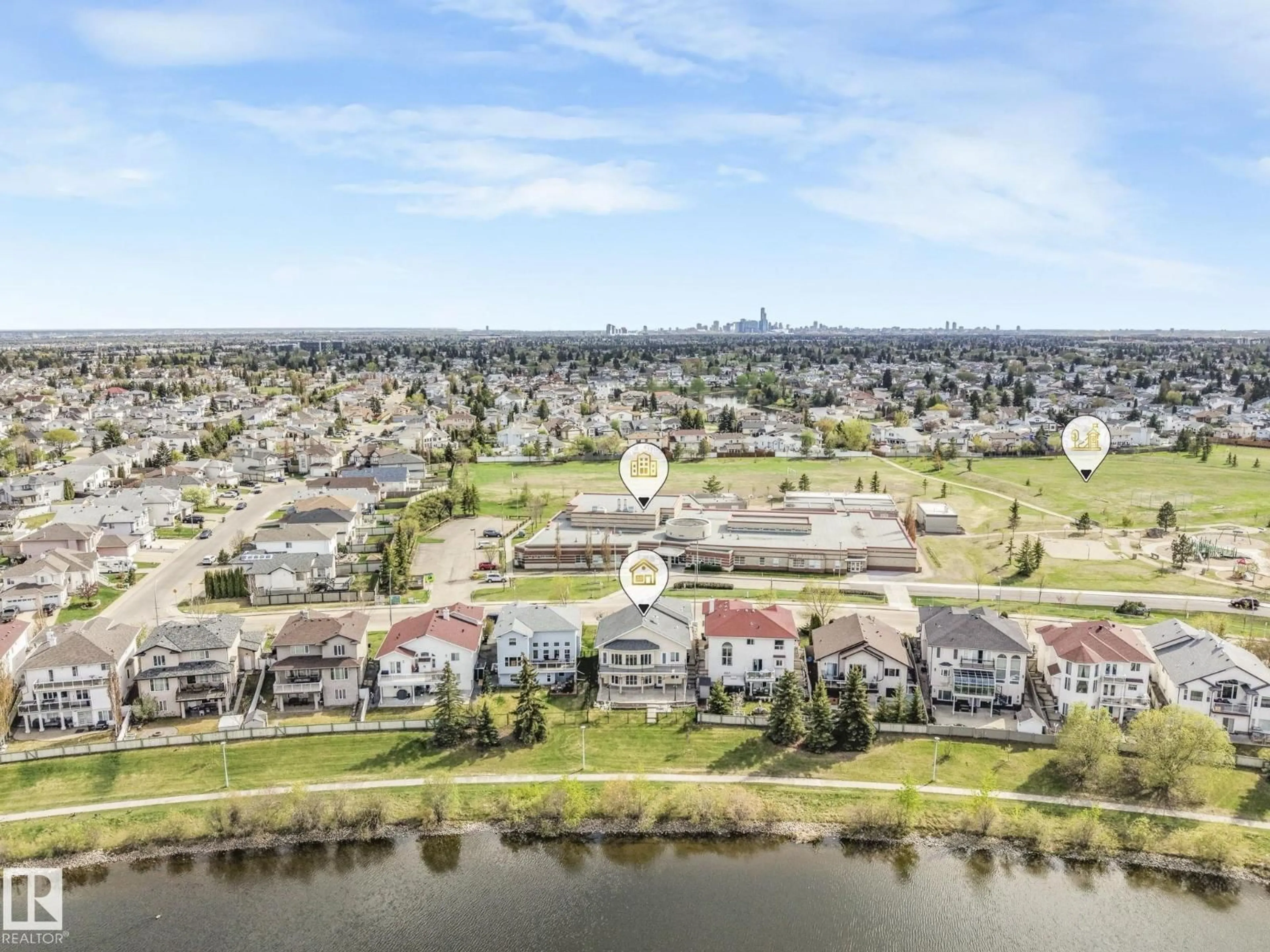 A pic from outside/outdoor area/front of a property/back of a property/a pic from drone, water/lake/river/ocean view for 7504 161A AV, Edmonton Alberta T5Z3S9