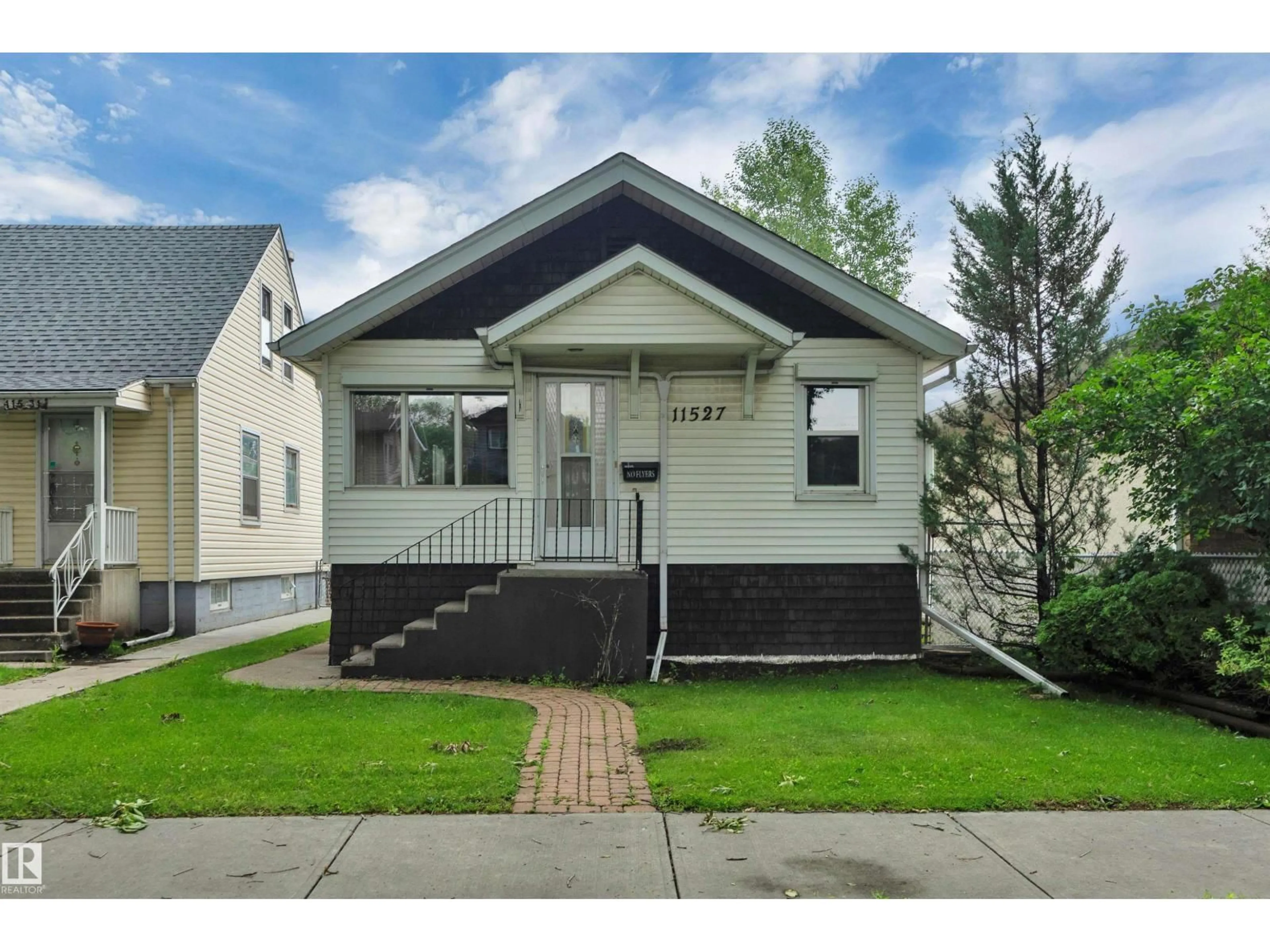 Home with vinyl exterior material, street for NW - 11527 88 ST, Edmonton Alberta T5B3R2
