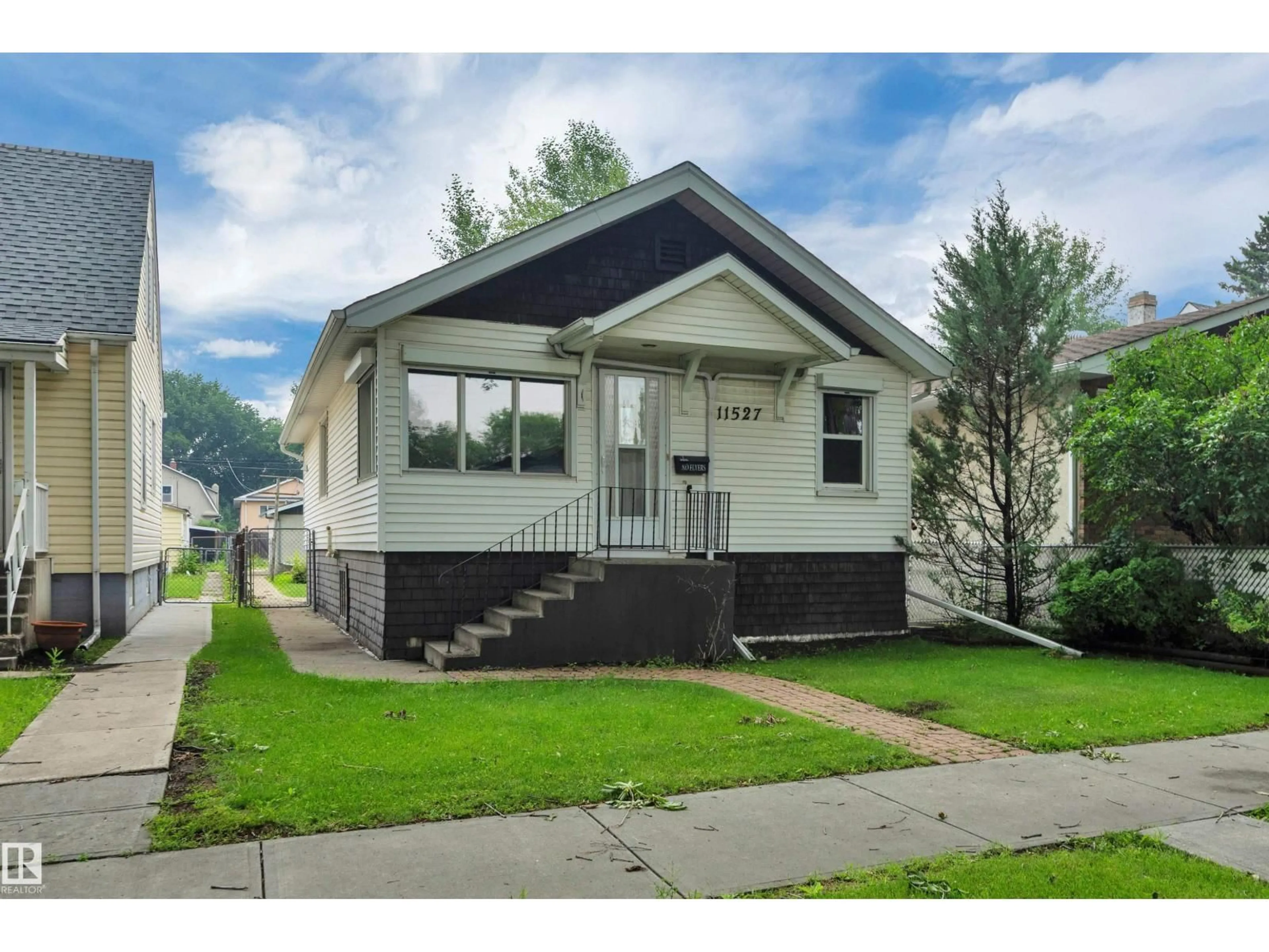 Home with vinyl exterior material, street for NW - 11527 88 ST, Edmonton Alberta T5B3R2