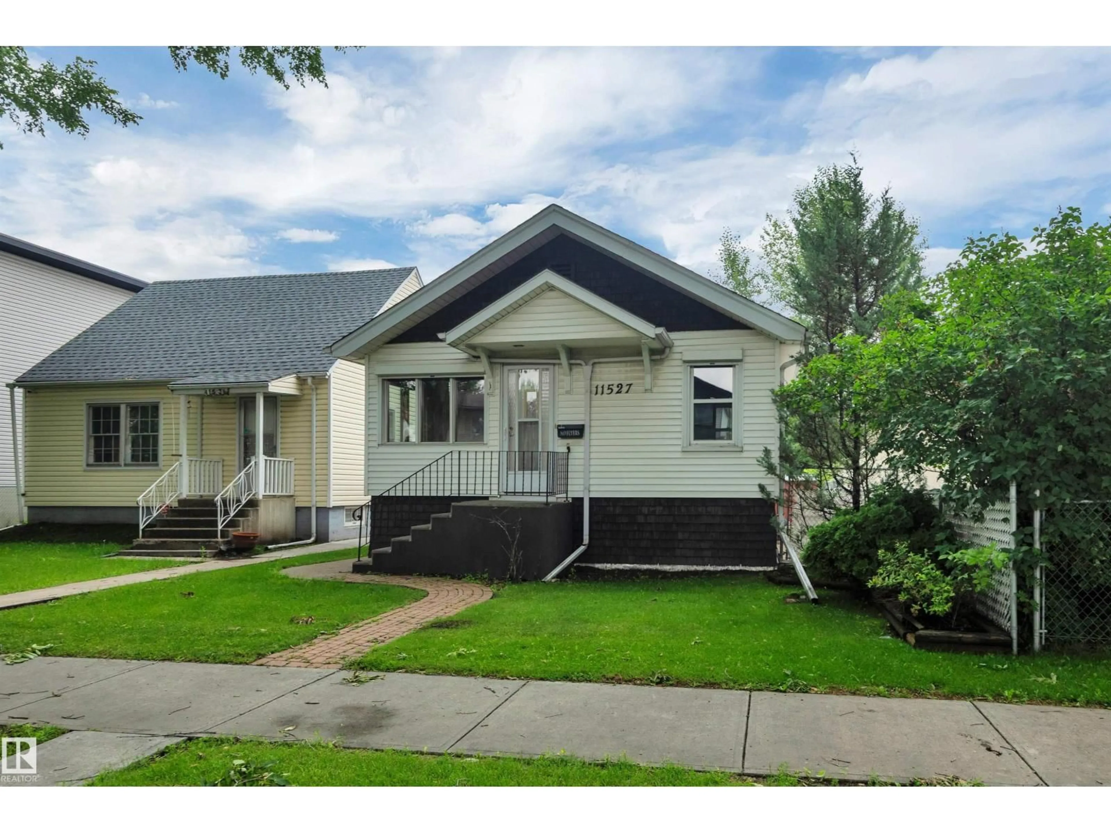 Home with vinyl exterior material, street for NW - 11527 88 ST, Edmonton Alberta T5B3R2