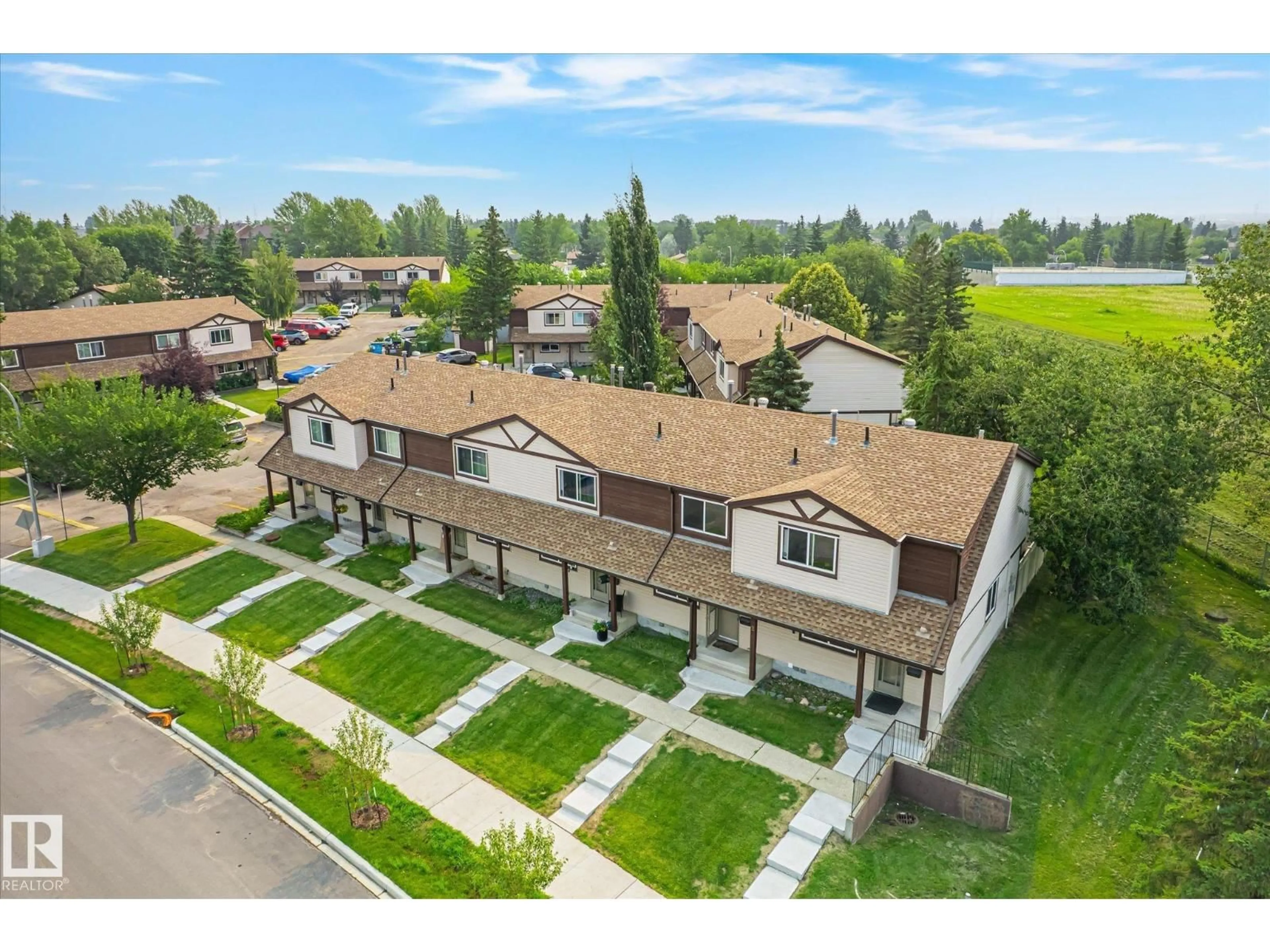 A pic from outside/outdoor area/front of a property/back of a property/a pic from drone, unknown for #2 - 13833 30 ST NW, Edmonton Alberta T5Y2B2
