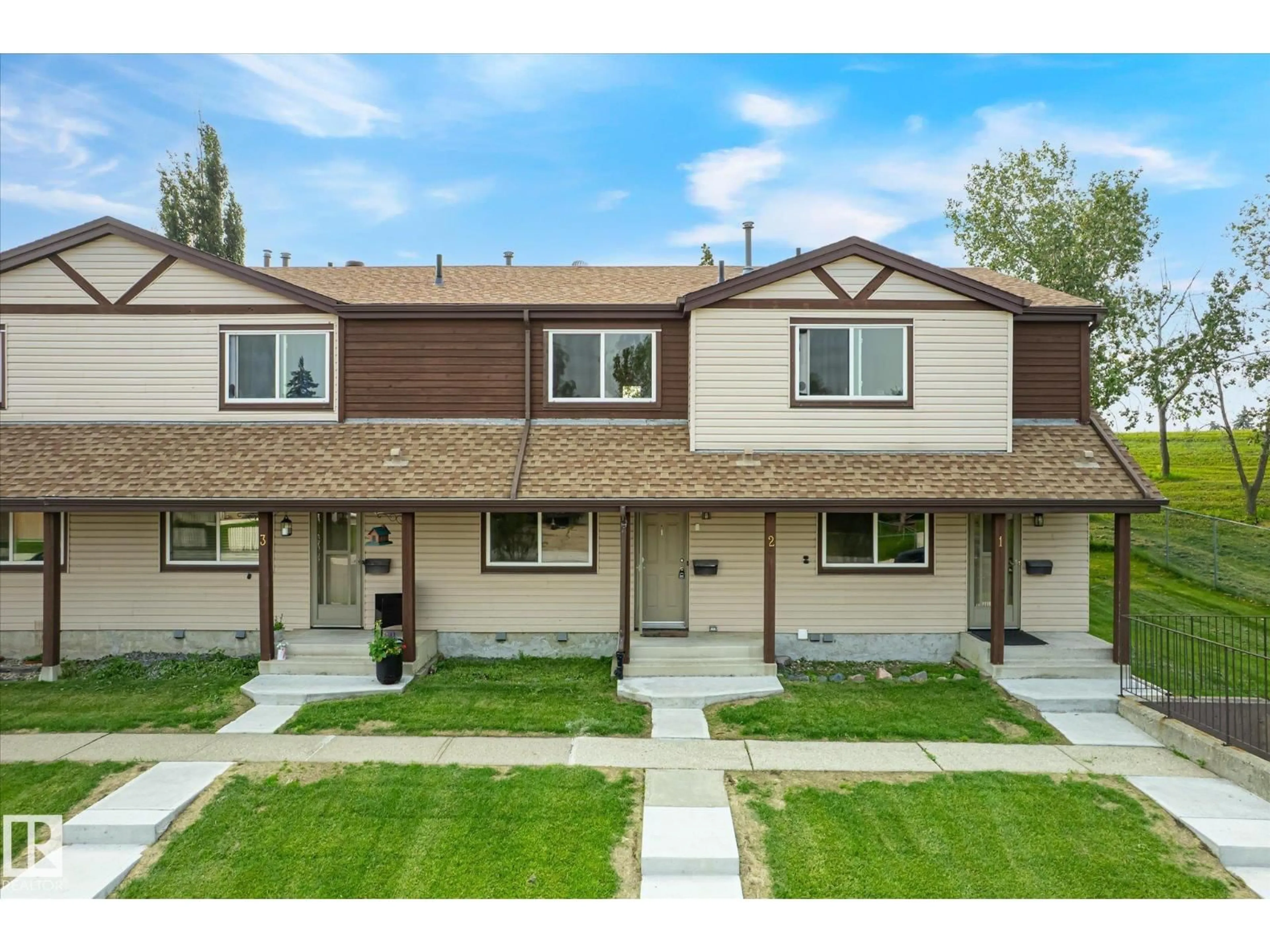 Home with vinyl exterior material, street for #2 - 13833 30 ST NW, Edmonton Alberta T5Y2B2