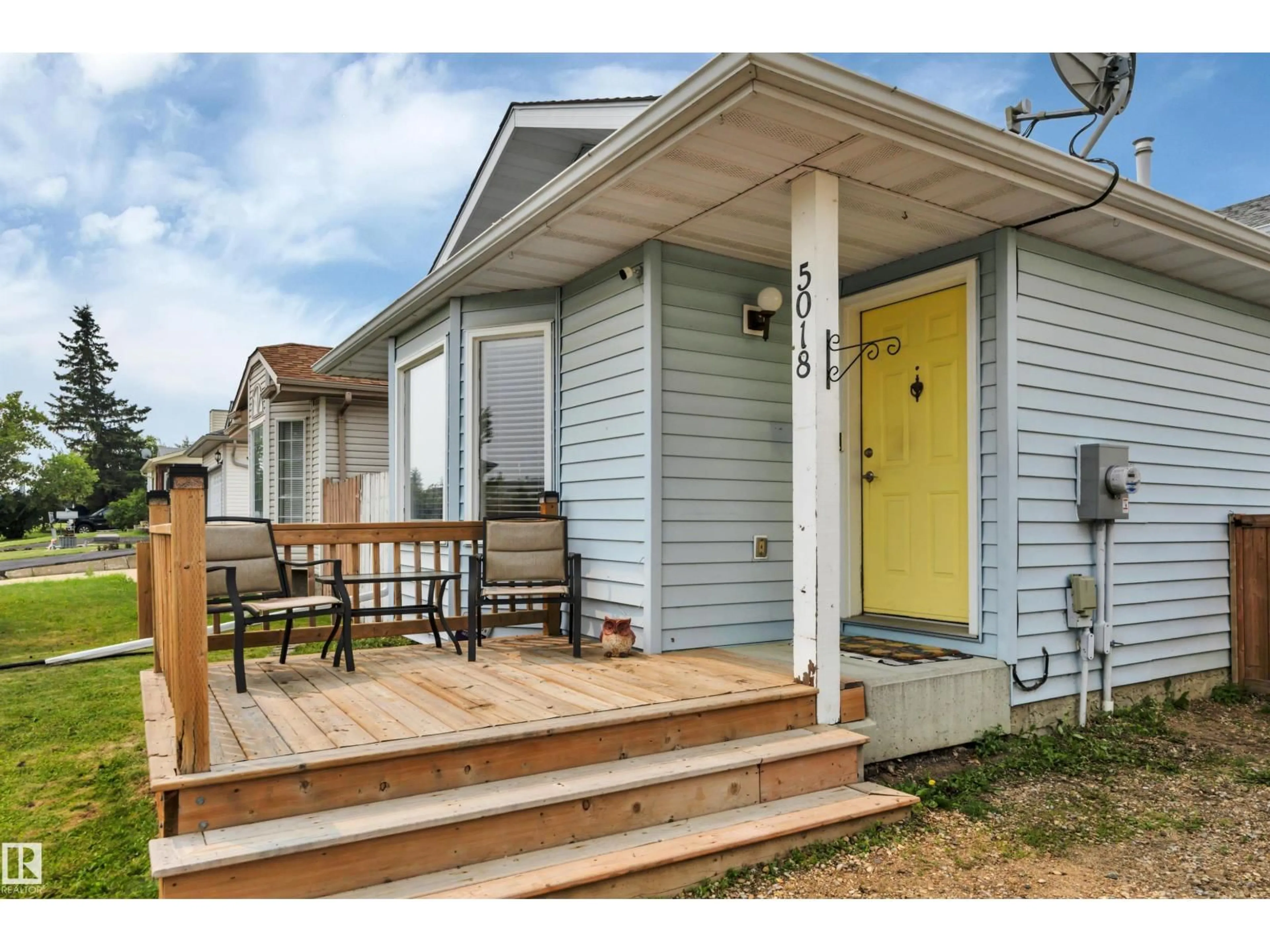 Home with vinyl exterior material, street for 5018 52 ST, Calmar Alberta T0C0V0