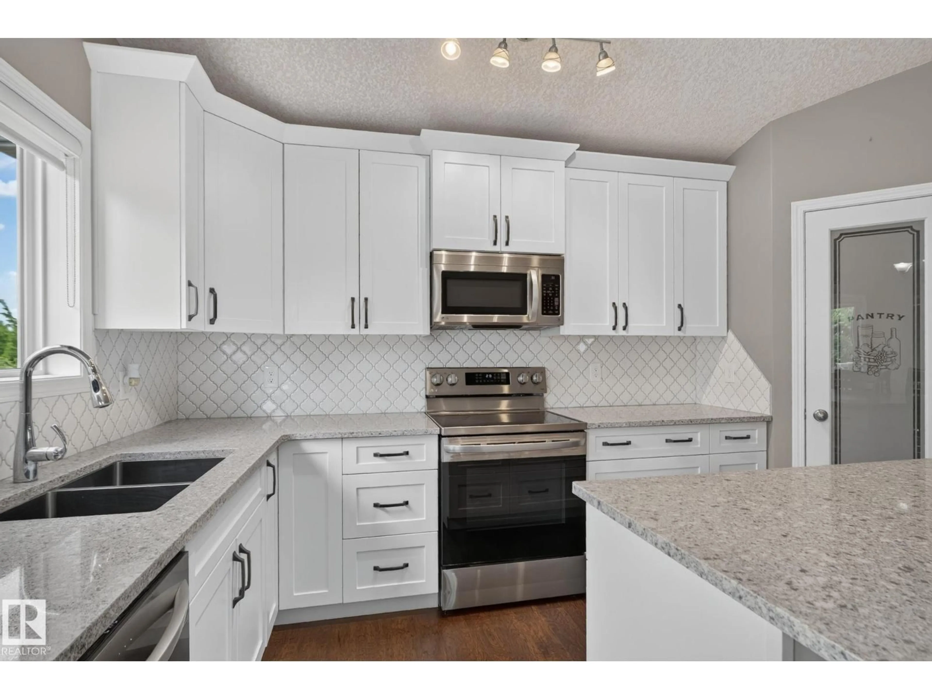 Open concept kitchen, ceramic/tile floor for 4914 152A AV, Edmonton Alberta T5Y3C1