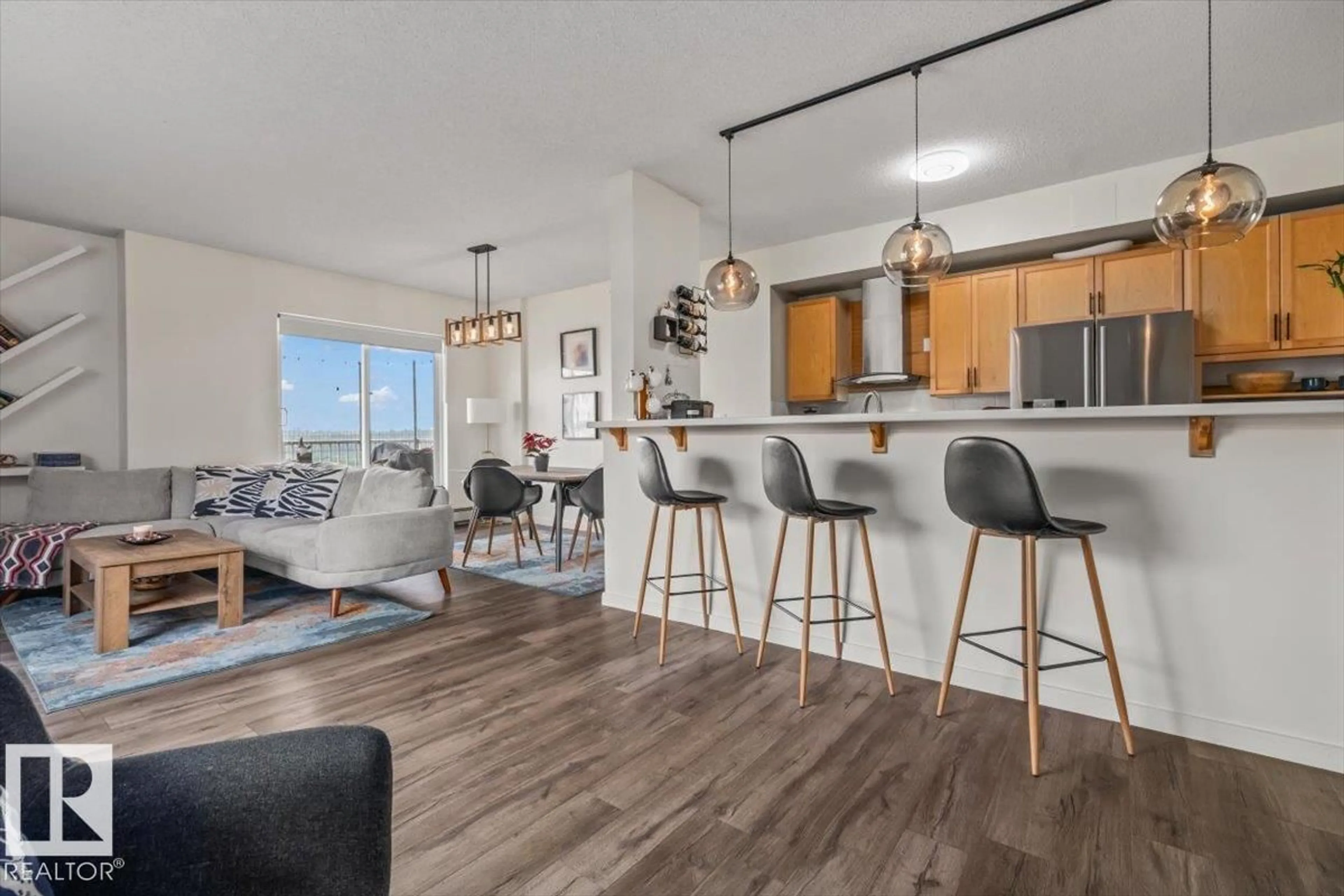 Open concept kitchen, wood/laminate floor for #704 - 9707 105 ST NW, Edmonton Alberta T5K2Y4
