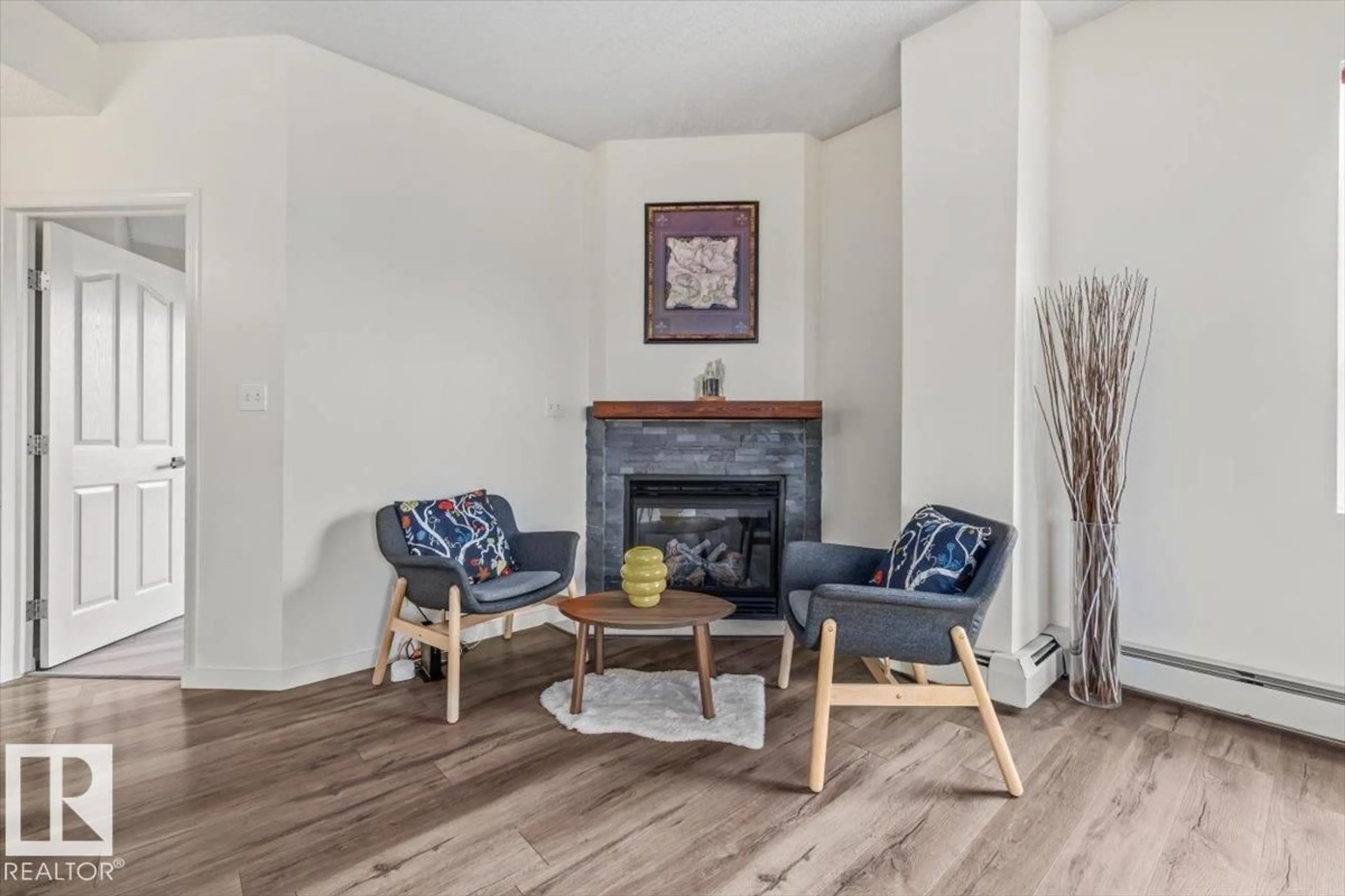Living room with furniture, wood/laminate floor for #704 - 9707 105 ST NW, Edmonton Alberta T5K2Y4