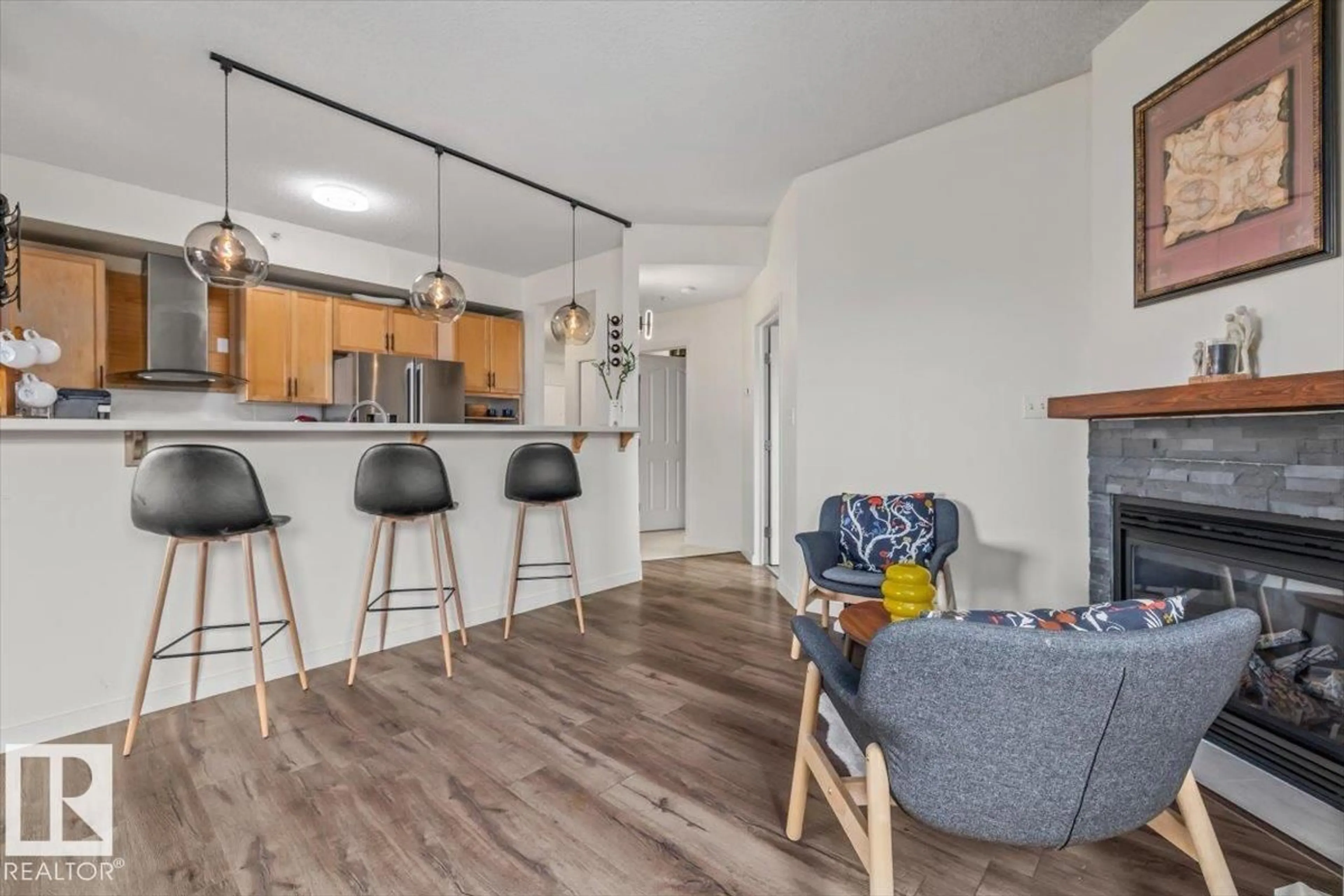 Open concept kitchen, wood/laminate floor for #704 - 9707 105 ST NW, Edmonton Alberta T5K2Y4
