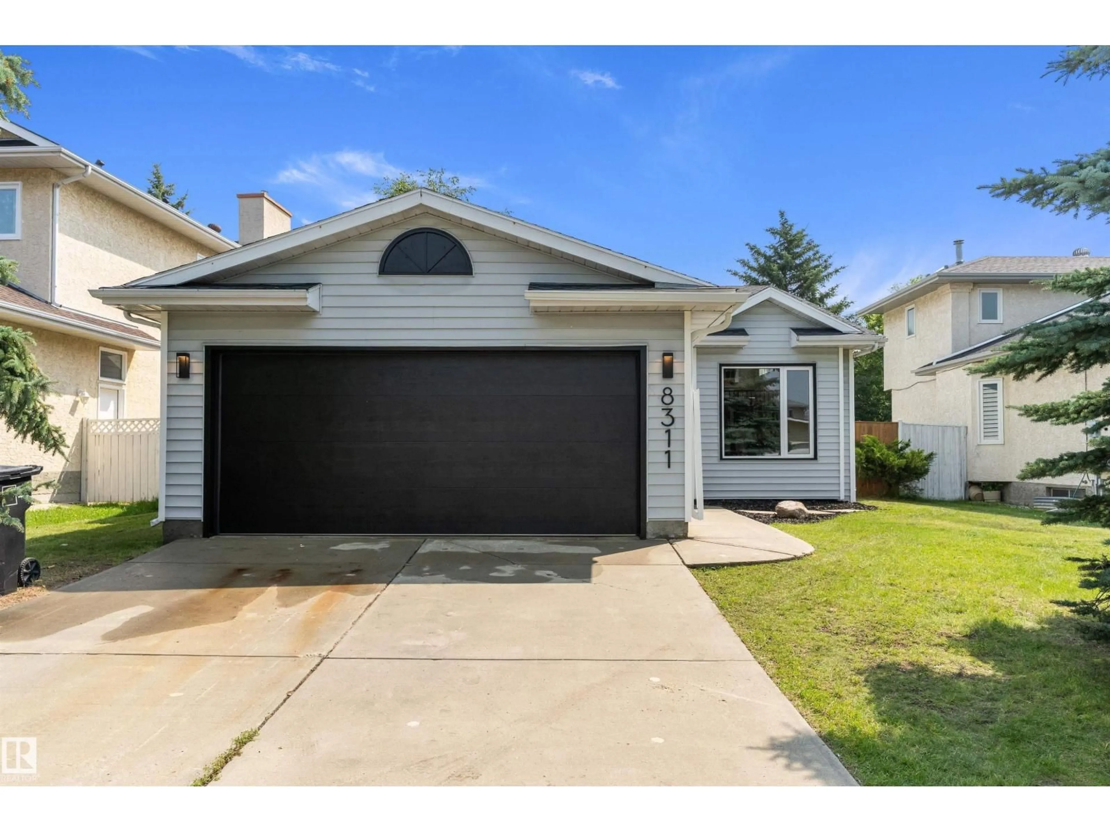 Home with vinyl exterior material, street for NW - 8311 184 ST, Edmonton Alberta T5T5V3