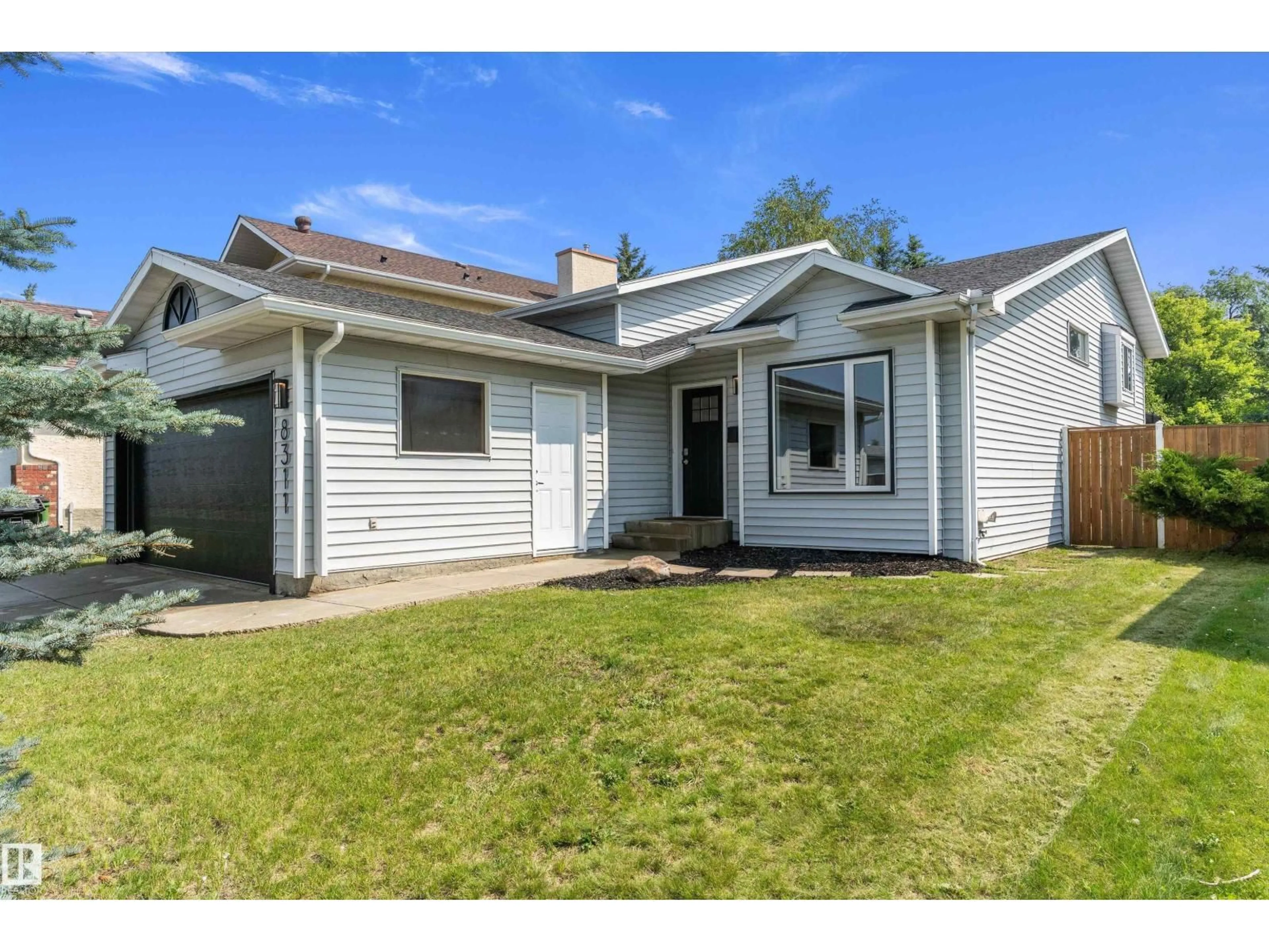 Home with vinyl exterior material, street for NW - 8311 184 ST, Edmonton Alberta T5T5V3