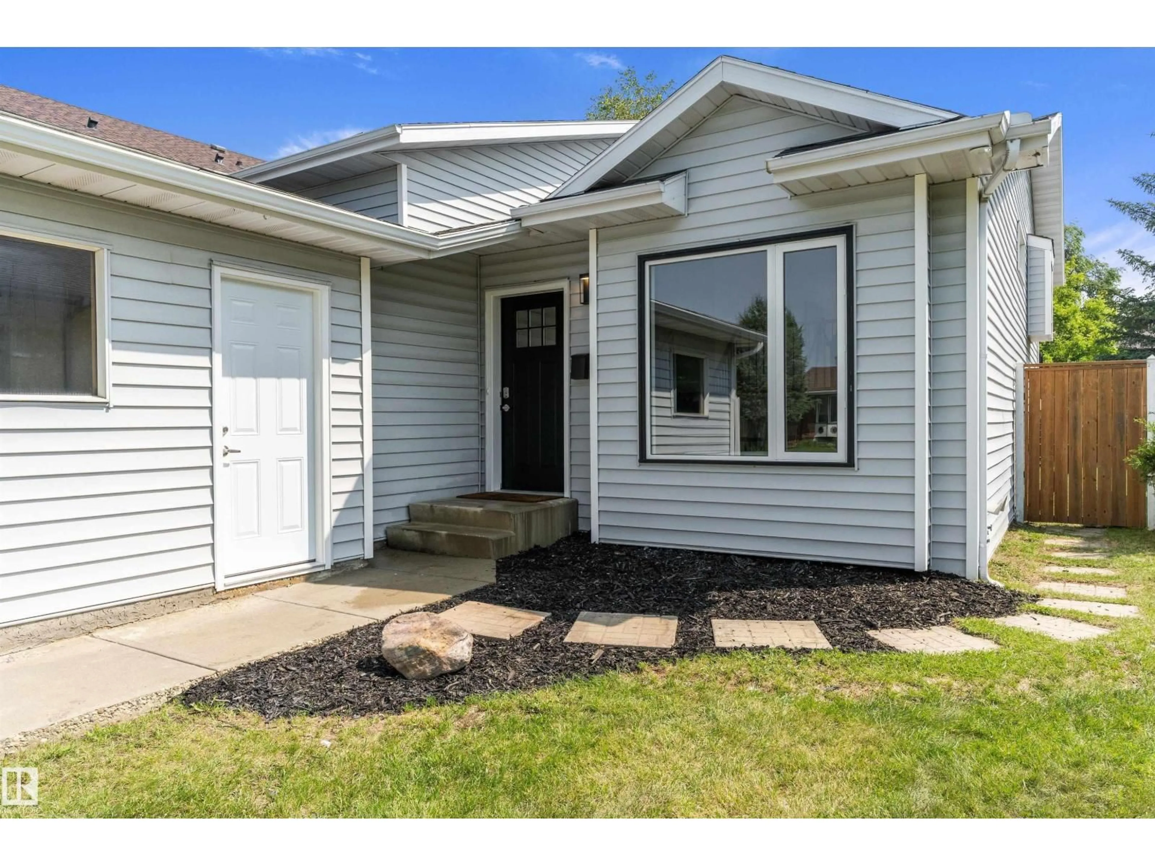 Home with vinyl exterior material, street for NW - 8311 184 ST, Edmonton Alberta T5T5V3