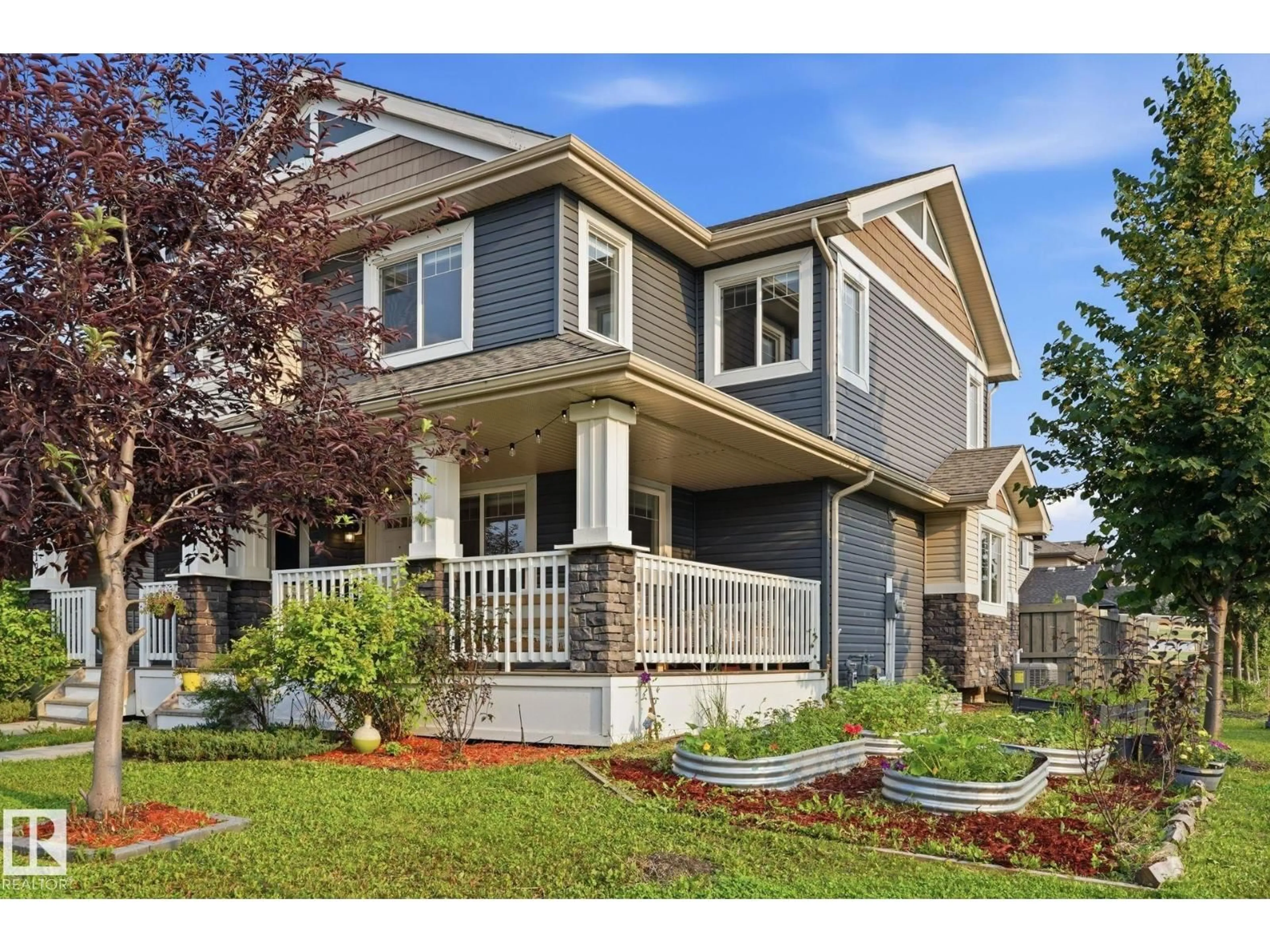 Home with vinyl exterior material, street for 17621 10 AV SW, Edmonton Alberta T6W1Z9