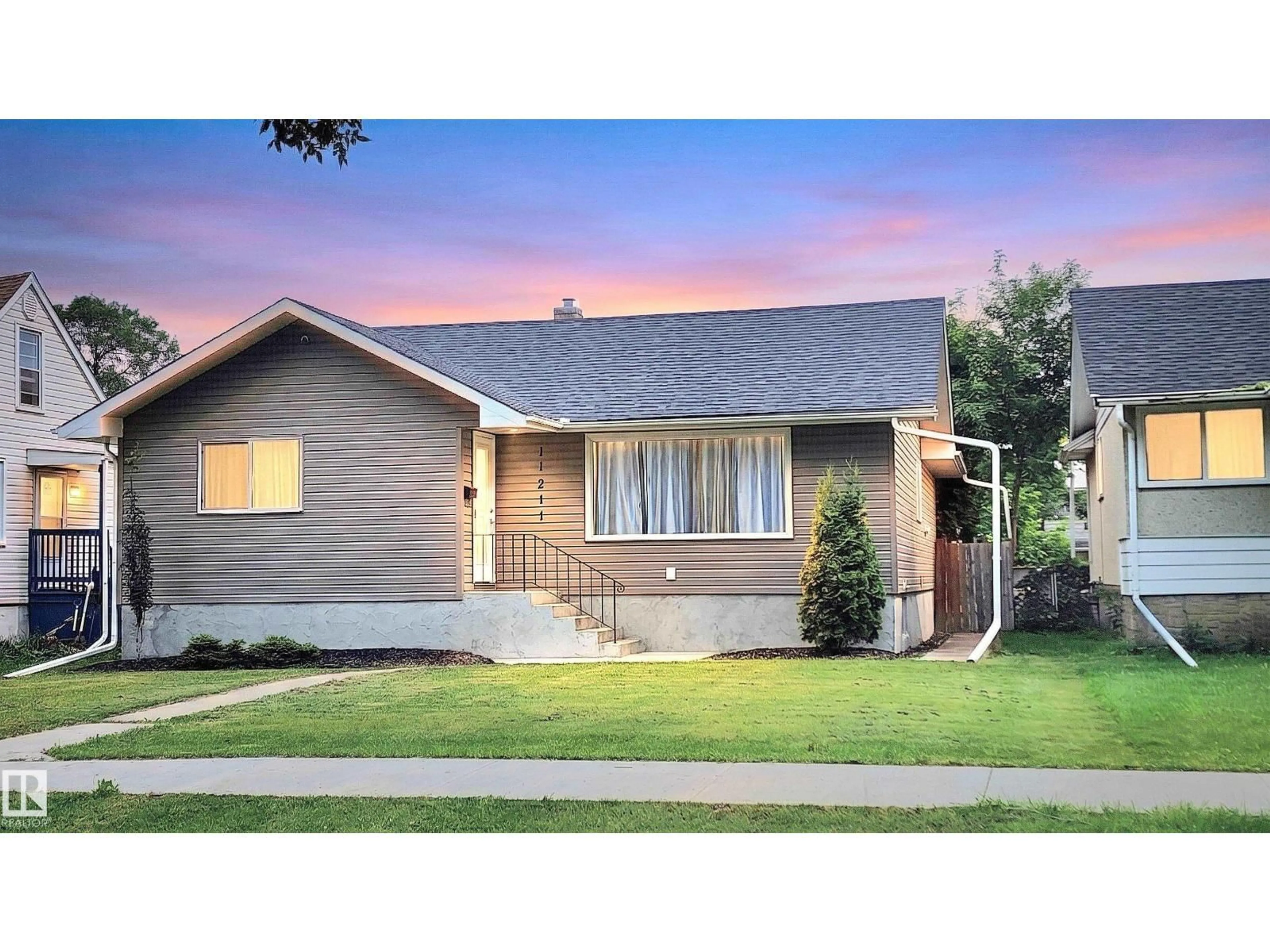 Home with vinyl exterior material, street for NW - 11211 104 ST, Edmonton Alberta T5G2K6