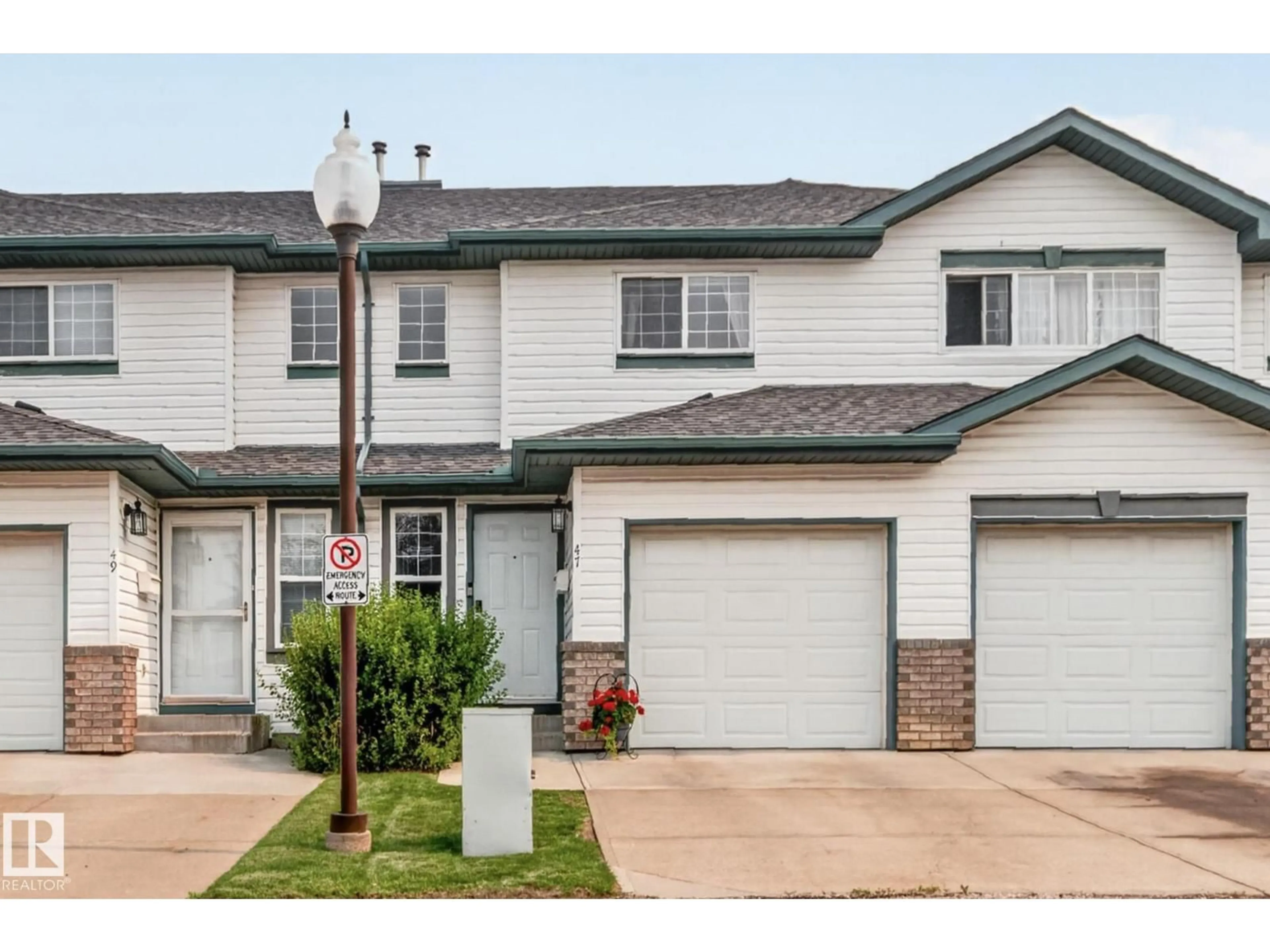 Home with vinyl exterior material, street for #47 - 16823 84 ST, Edmonton Alberta T5Z3S4