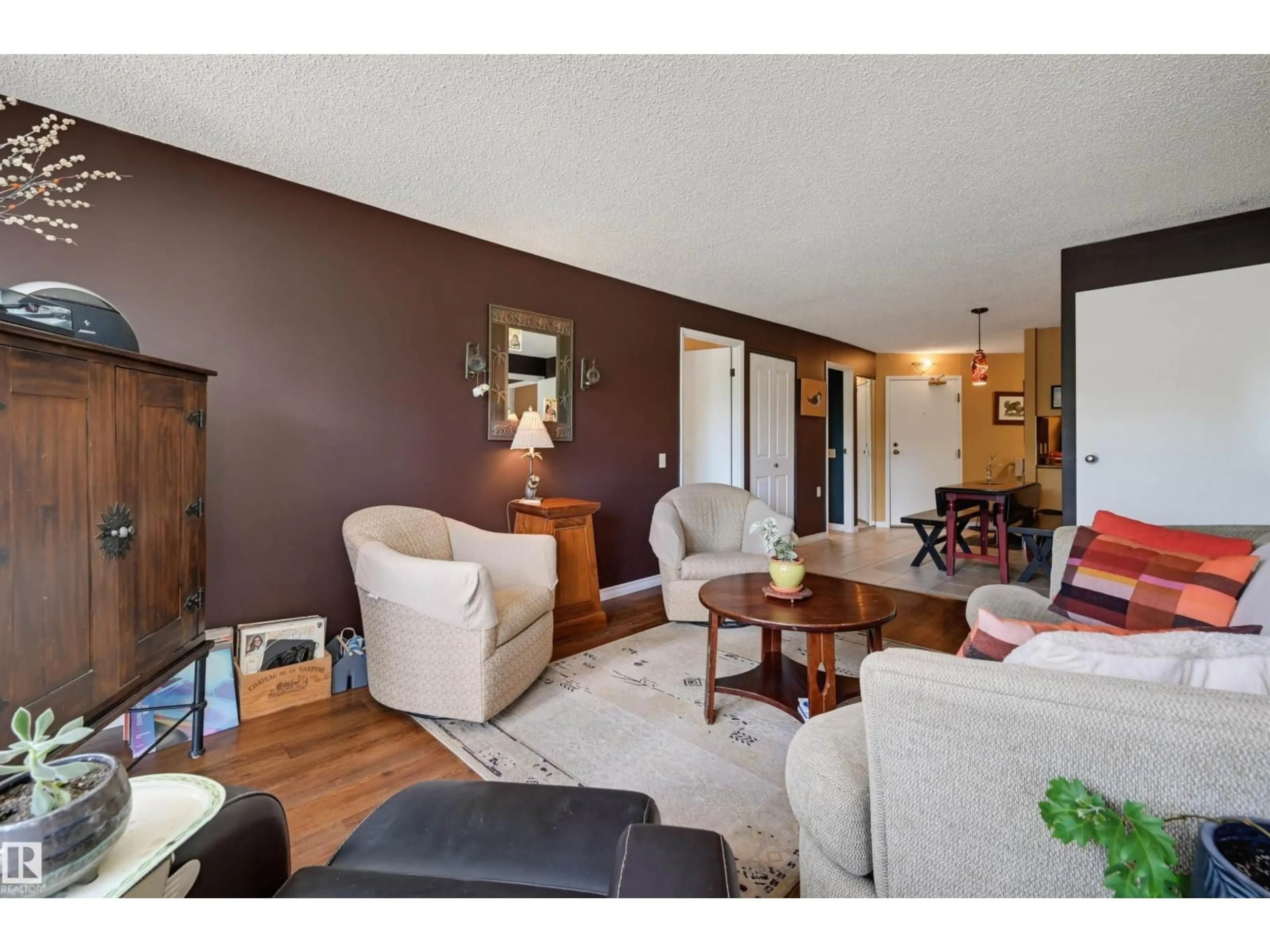 Living room with furniture, wood/laminate floor for 210 - 10149 SASKATCHEWAN DR, Edmonton Alberta T6E6B6