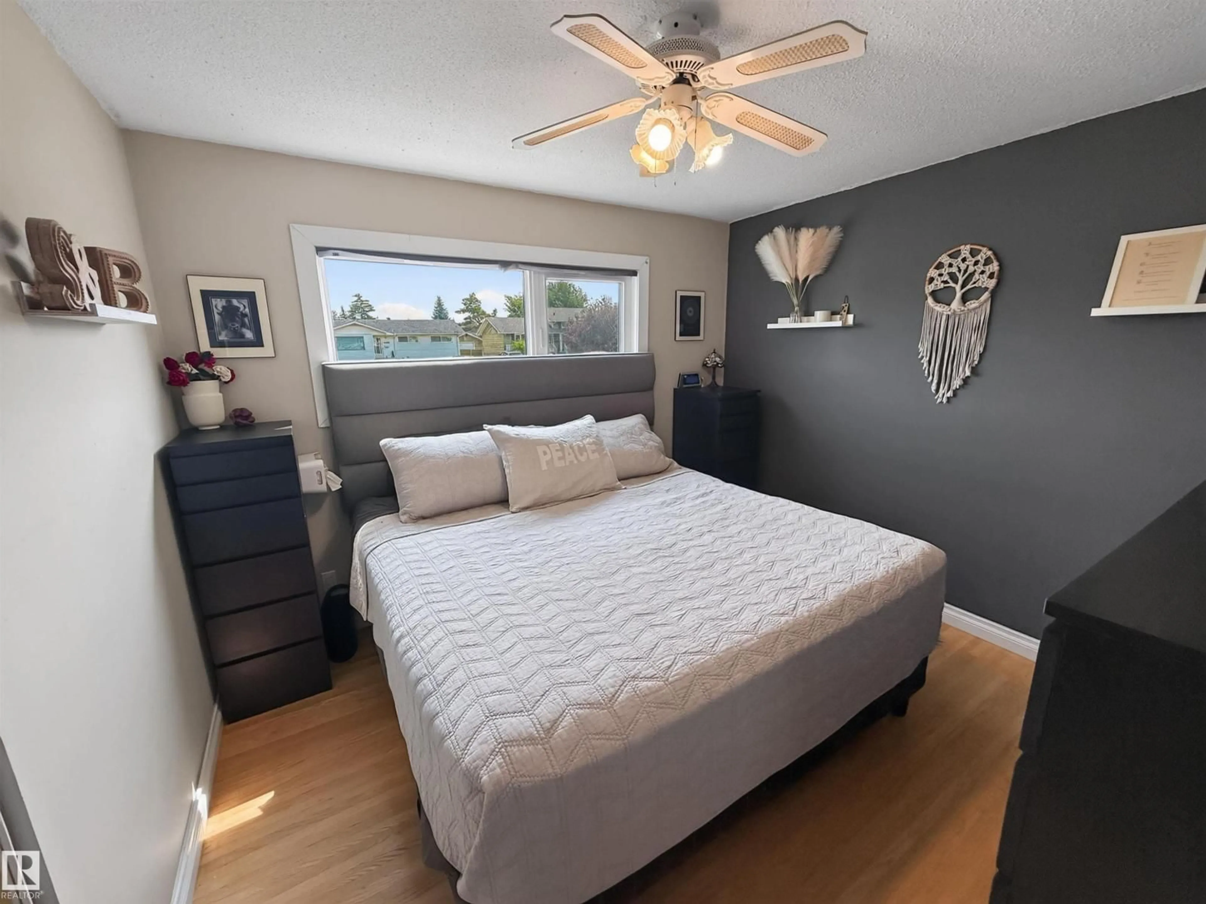Bedroom with bed, wood/laminate floor for 16046 95 AV, Edmonton Alberta T5P0A7