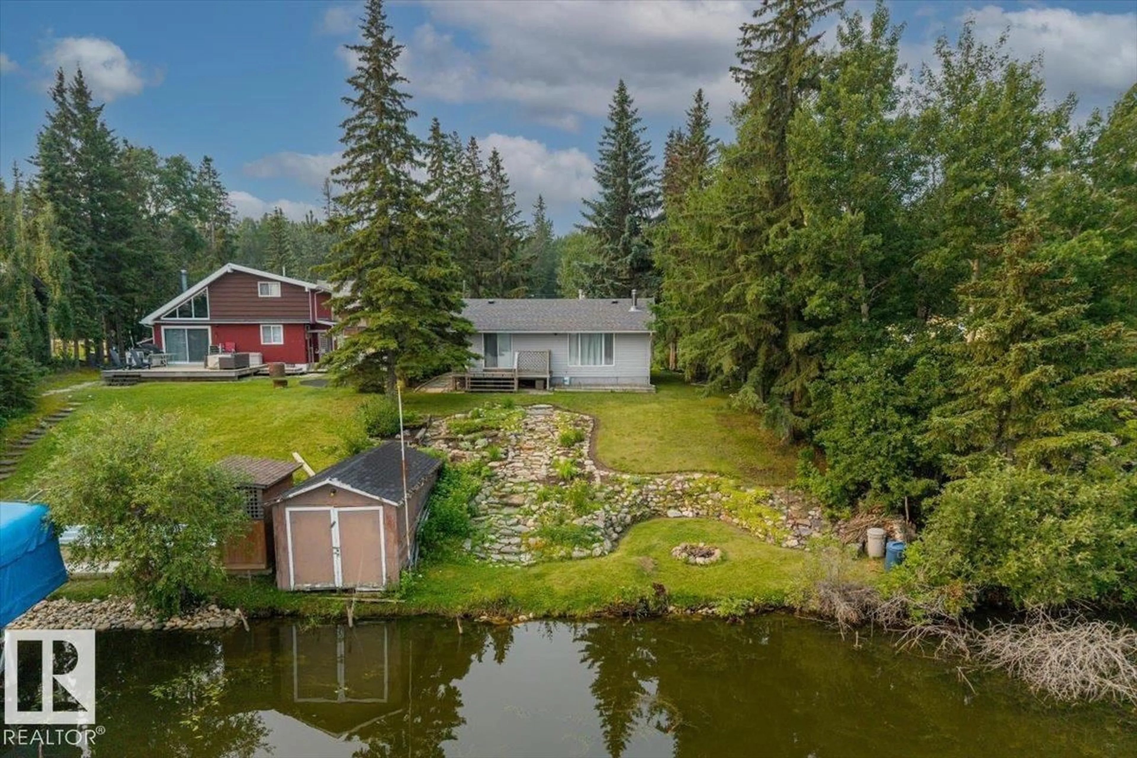 A pic from outside/outdoor area/front of a property/back of a property/a pic from drone, water/lake/river/ocean view for 5564 NAKAMUN DR, Rural Lac Ste. Anne County Alberta T0E1A0