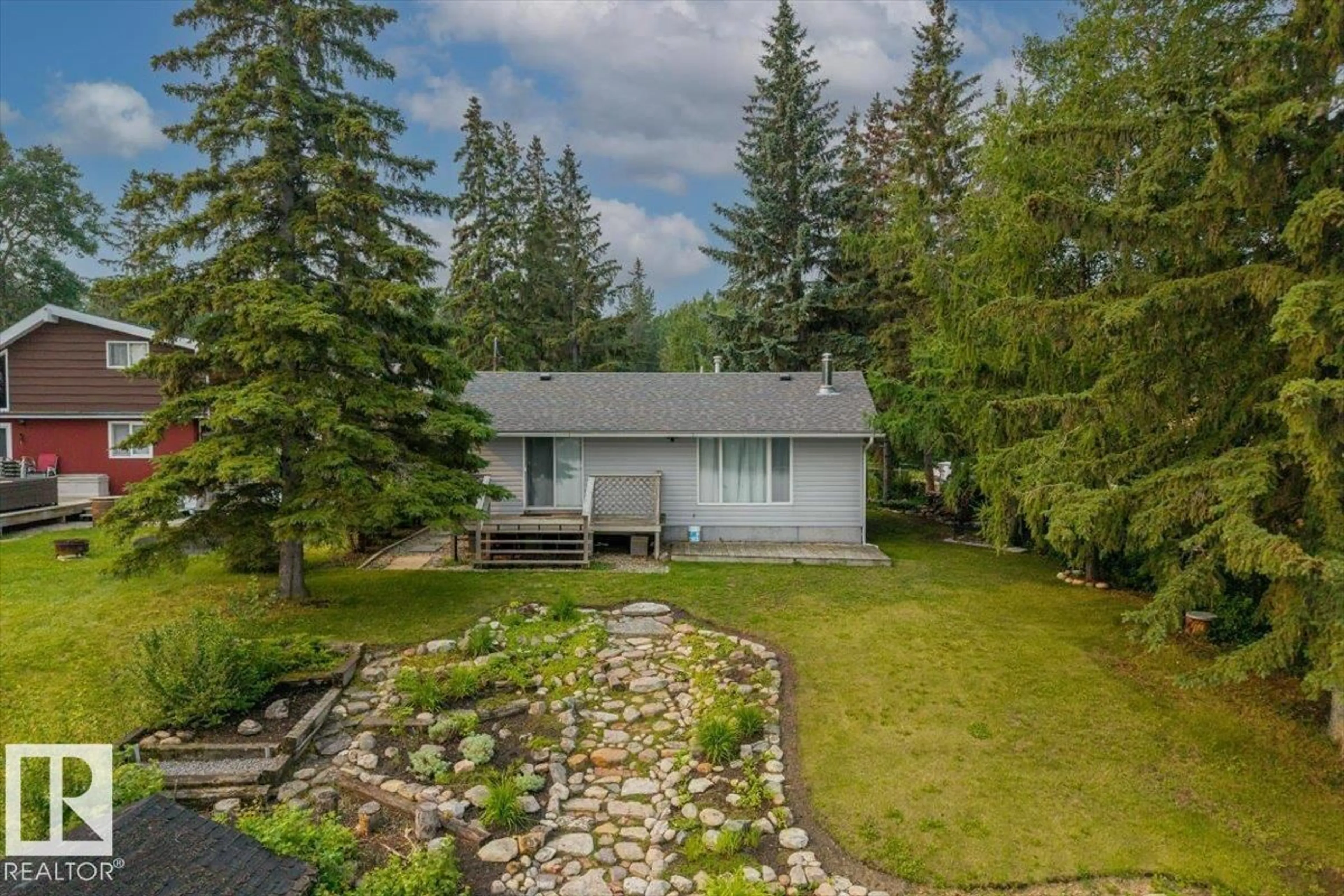 A pic from outside/outdoor area/front of a property/back of a property/a pic from drone, forest/trees view for 5564 NAKAMUN DR, Rural Lac Ste. Anne County Alberta T0E1A0