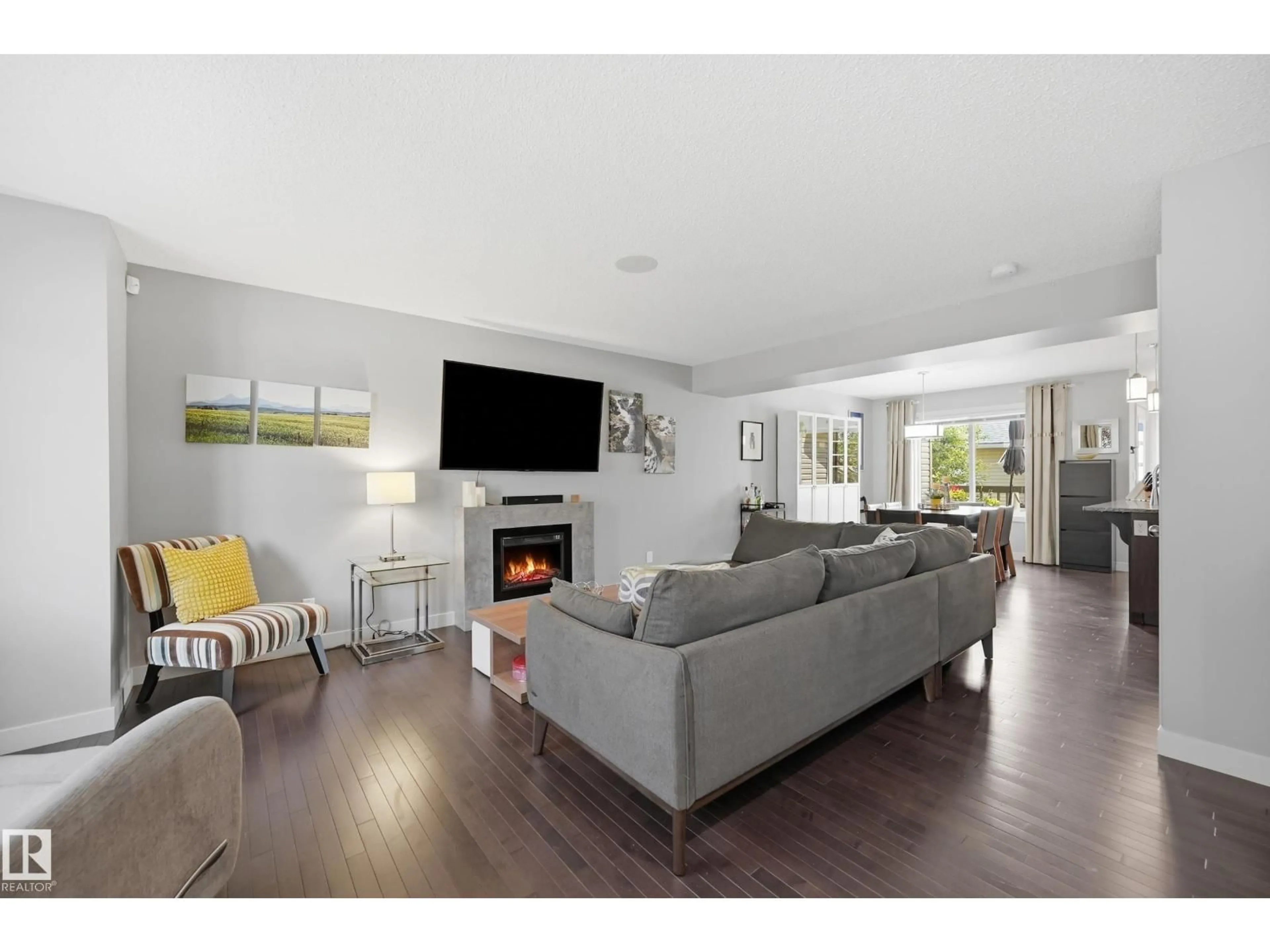 Living room with furniture, wood/laminate floor for SW SW - 704 176 ST, Edmonton Alberta T6W2G7