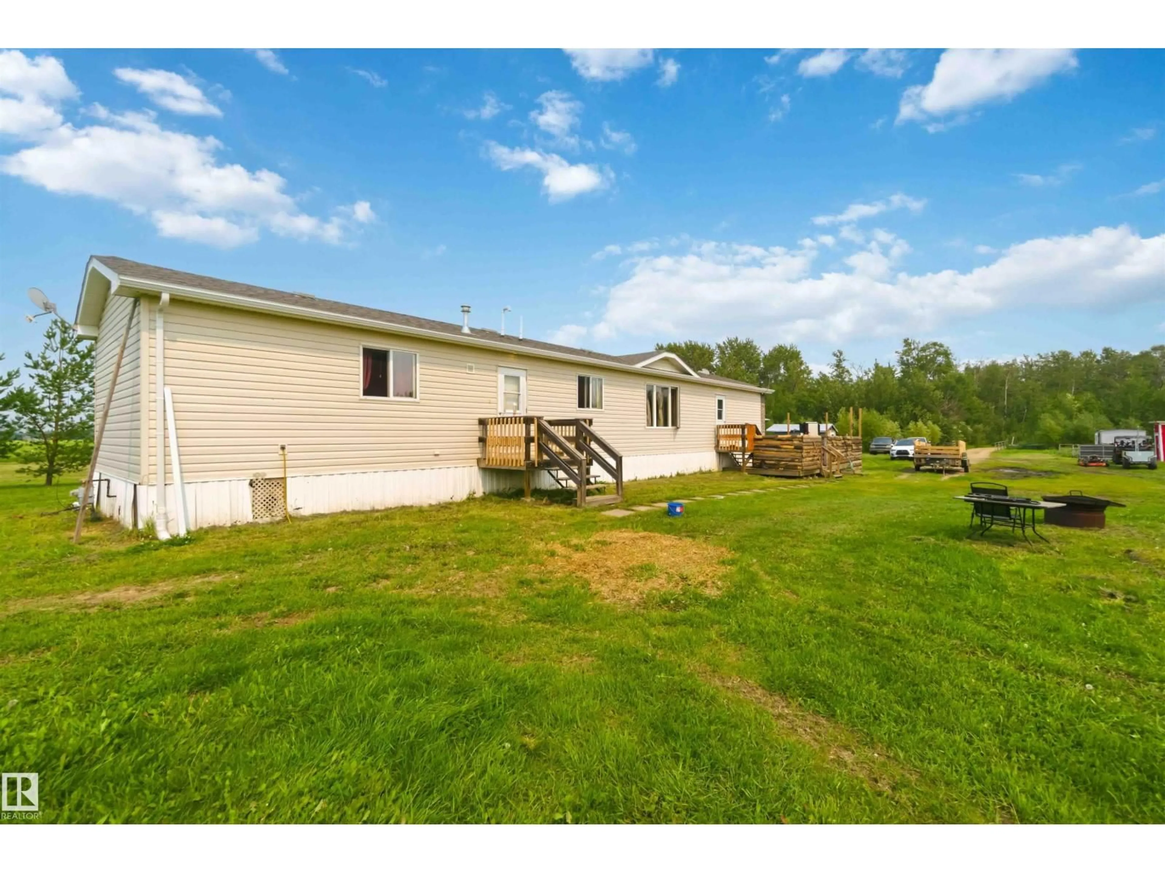 A pic from outside/outdoor area/front of a property/back of a property/a pic from drone, water/lake/river/ocean view for 273 - 58502 RNG RD 2, Rural Westlock County Alberta T0G1W0