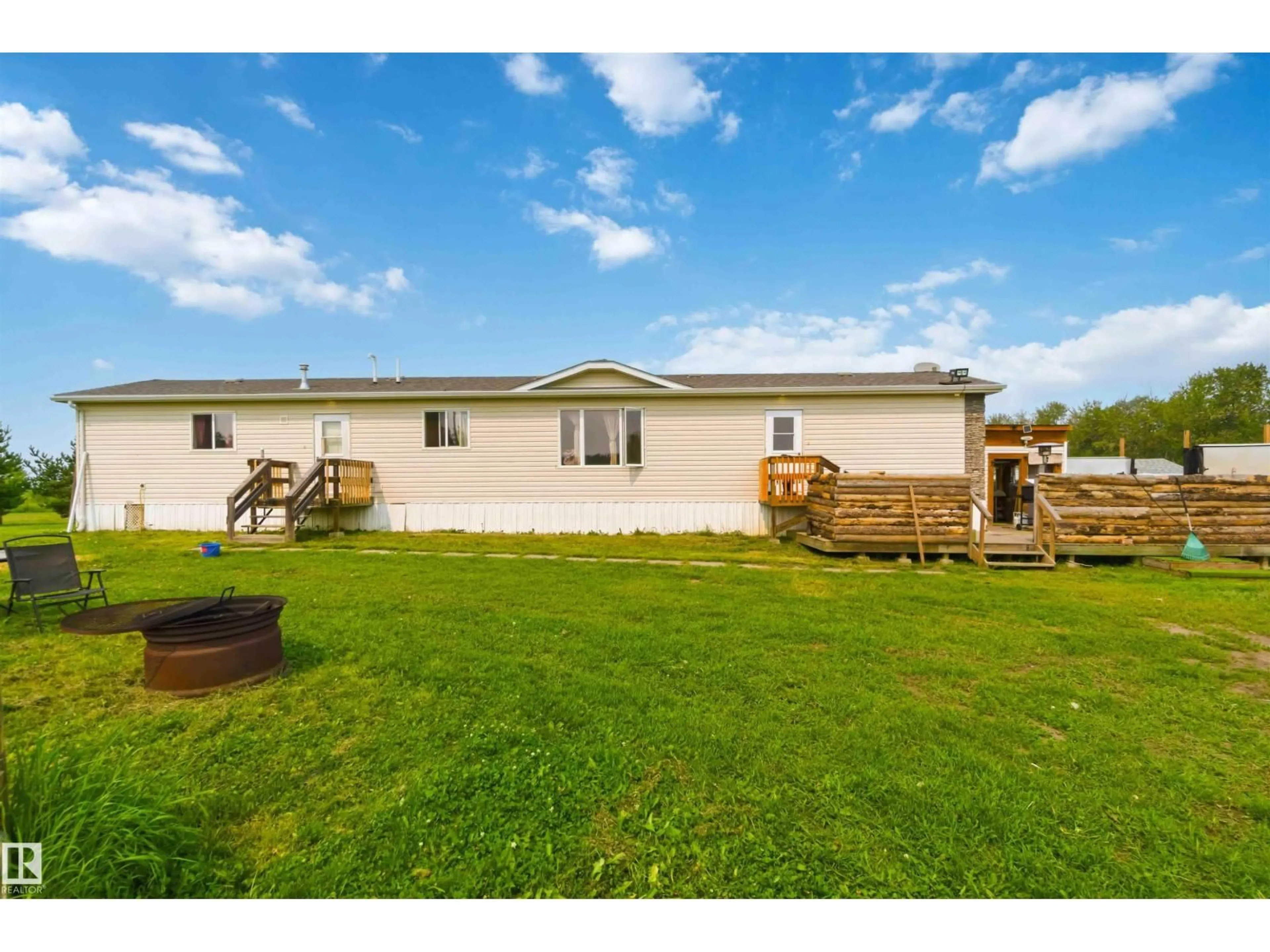 A pic from outside/outdoor area/front of a property/back of a property/a pic from drone, water/lake/river/ocean view for 273 - 58502 RNG RD 2, Rural Westlock County Alberta T0G1W0