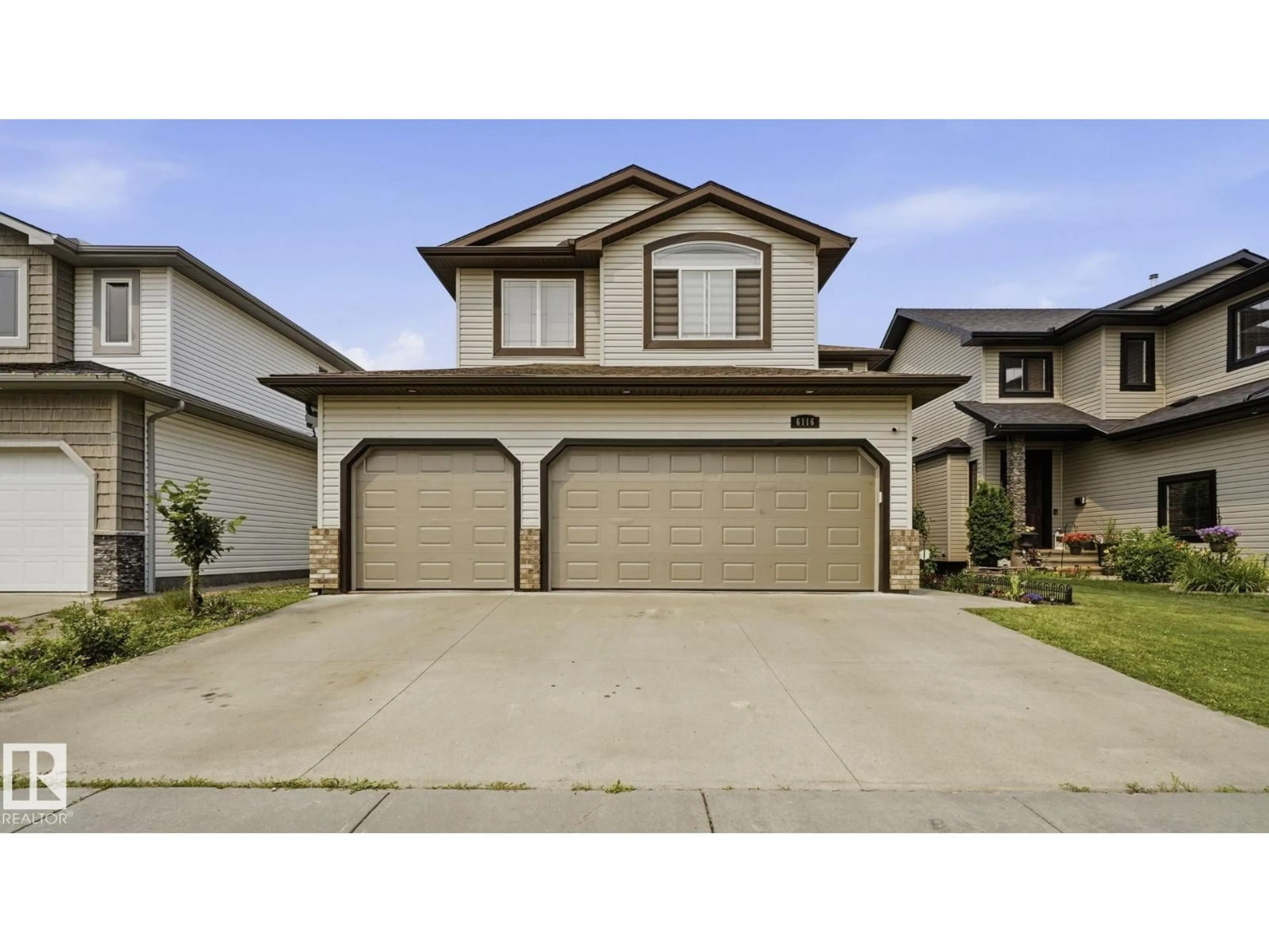 Home with vinyl exterior material, street for 6116 53 AV, Beaumont Alberta T4X1V6