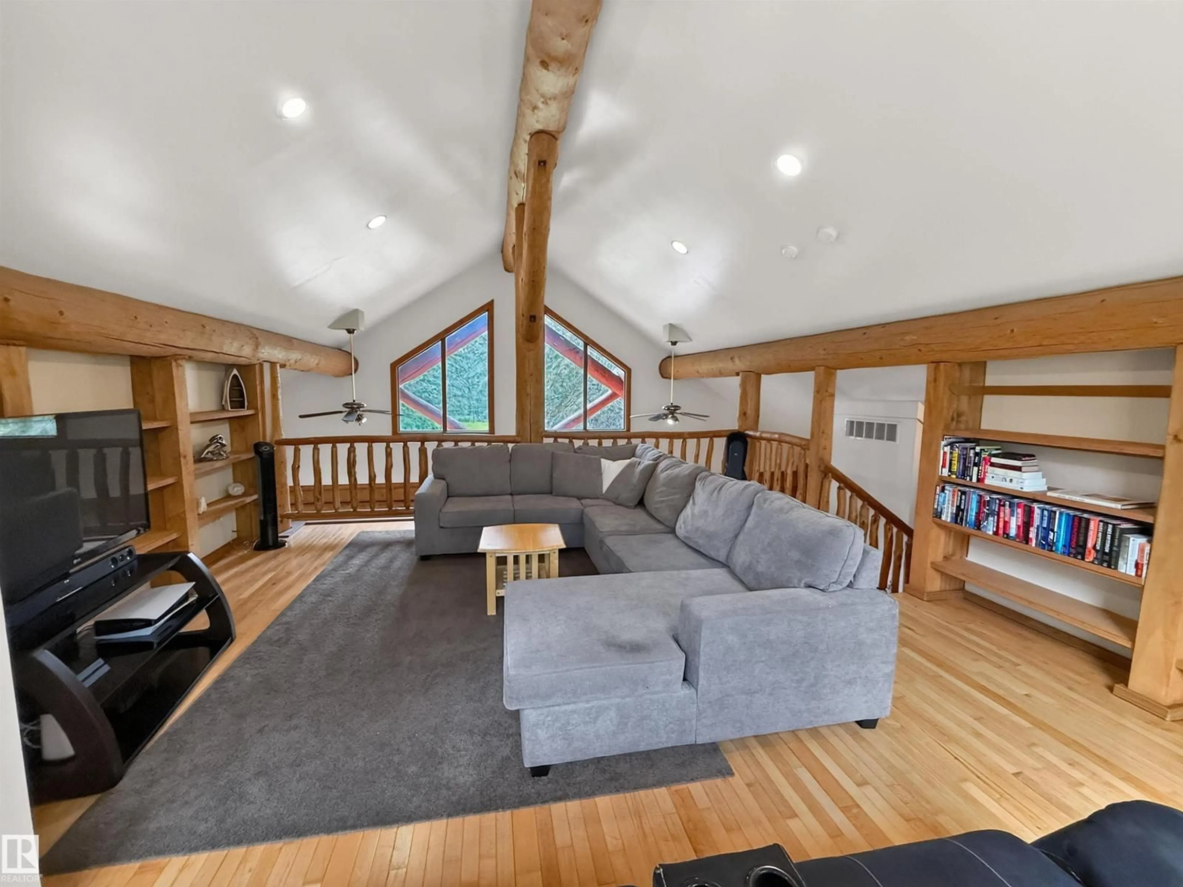 Living room with furniture, wood/laminate floor for 53305 - 105 RGE ROAD 280, Rural Parkland County Alberta T7X3V7