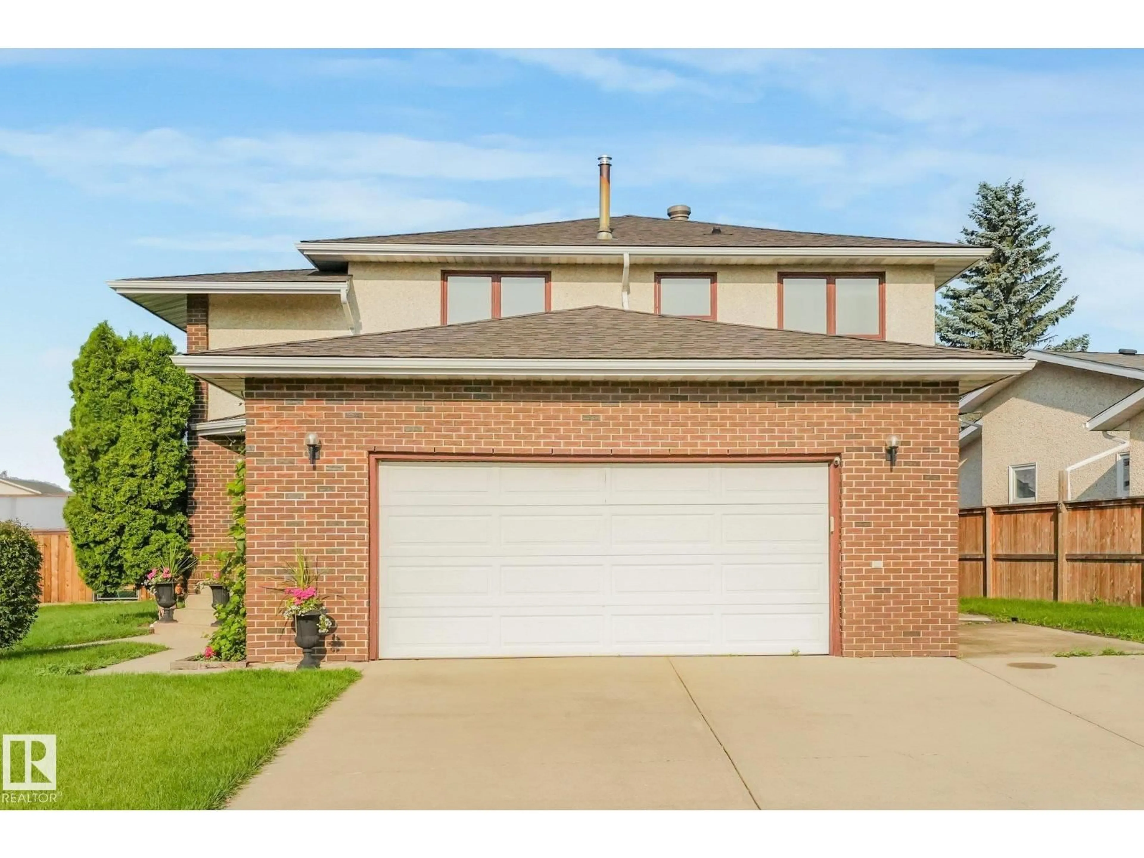 Home with brick exterior material, street for 5504 150 AV NW, Edmonton Alberta T5A2L2