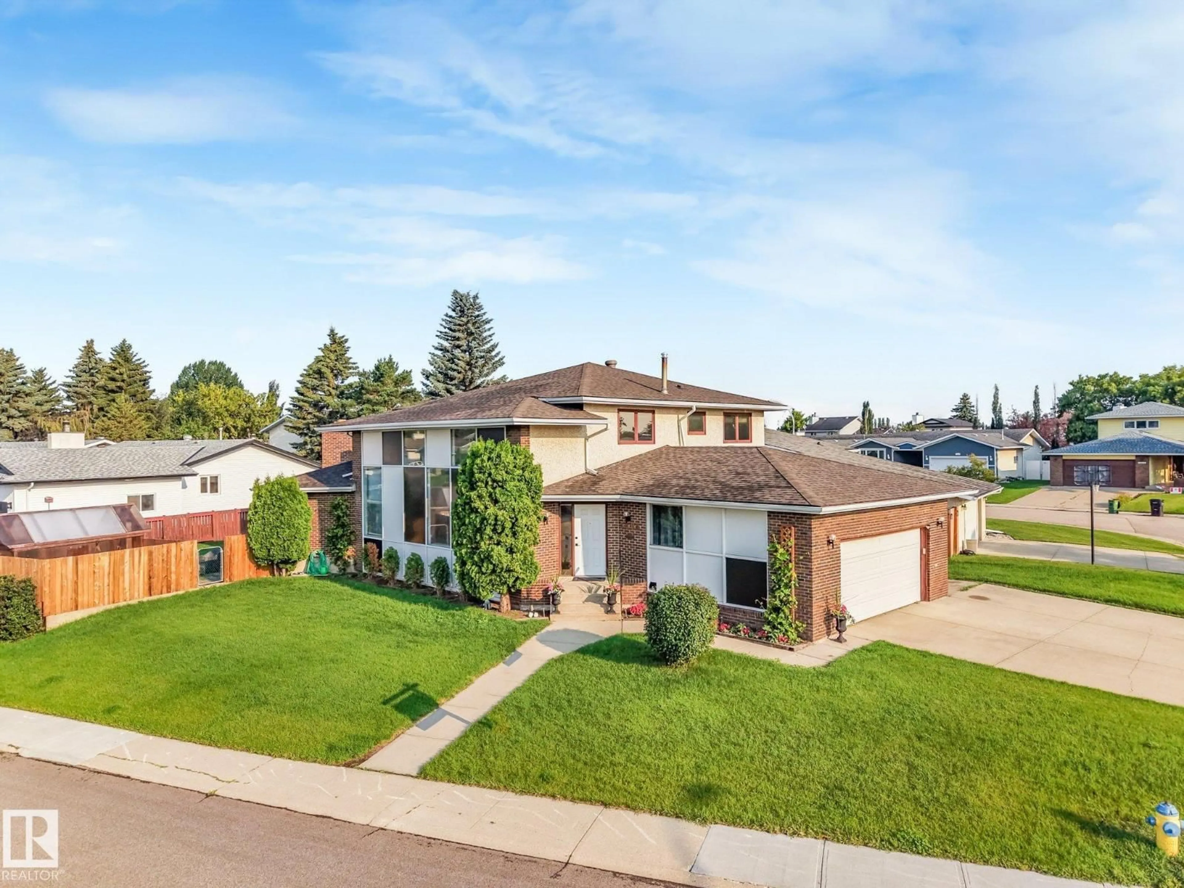 A pic from outside/outdoor area/front of a property/back of a property/a pic from drone, street for 5504 150 AV NW, Edmonton Alberta T5A2L2