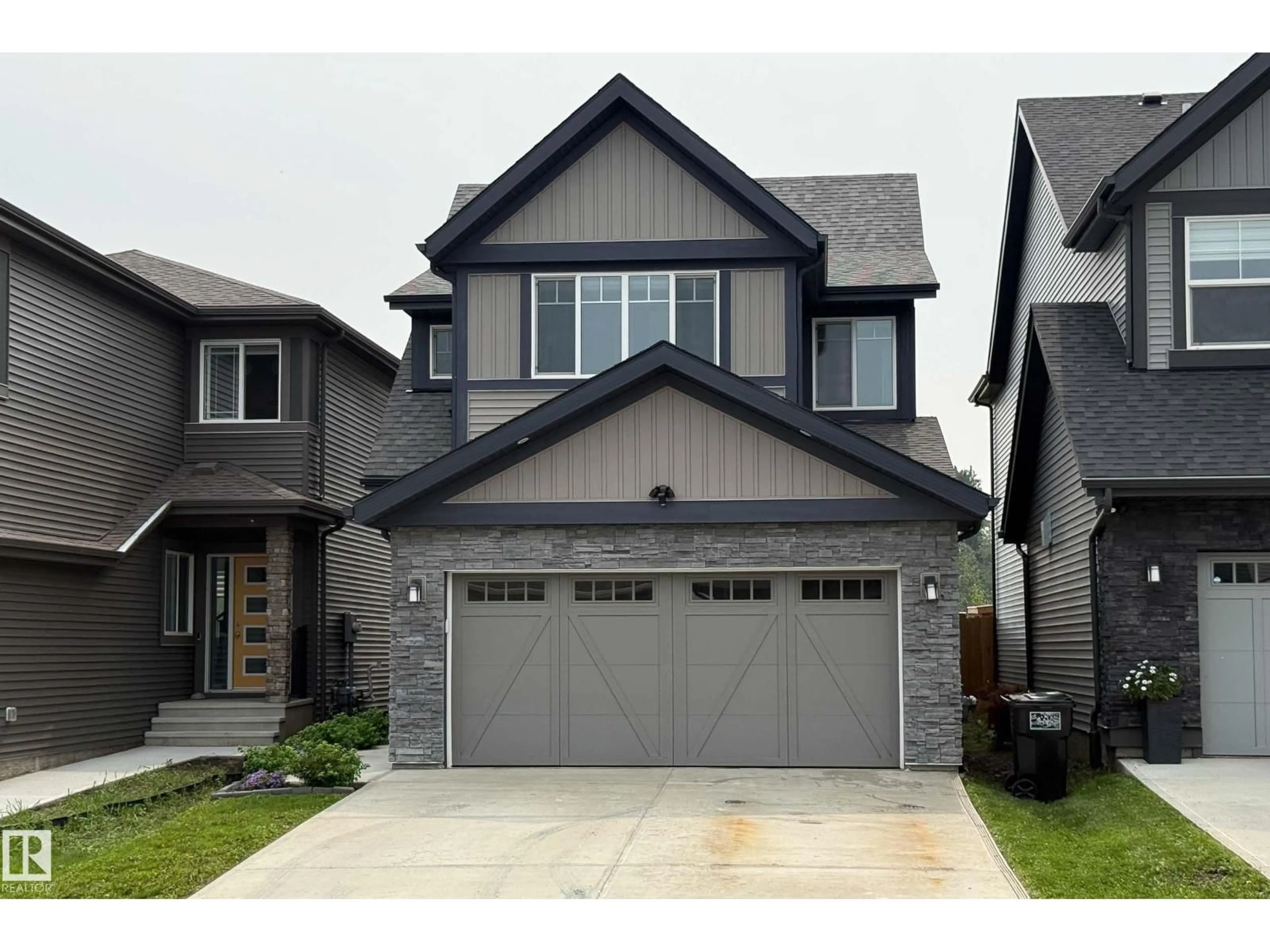 Home with vinyl exterior material, street for 21035 128 AV, Edmonton Alberta T5S0R5