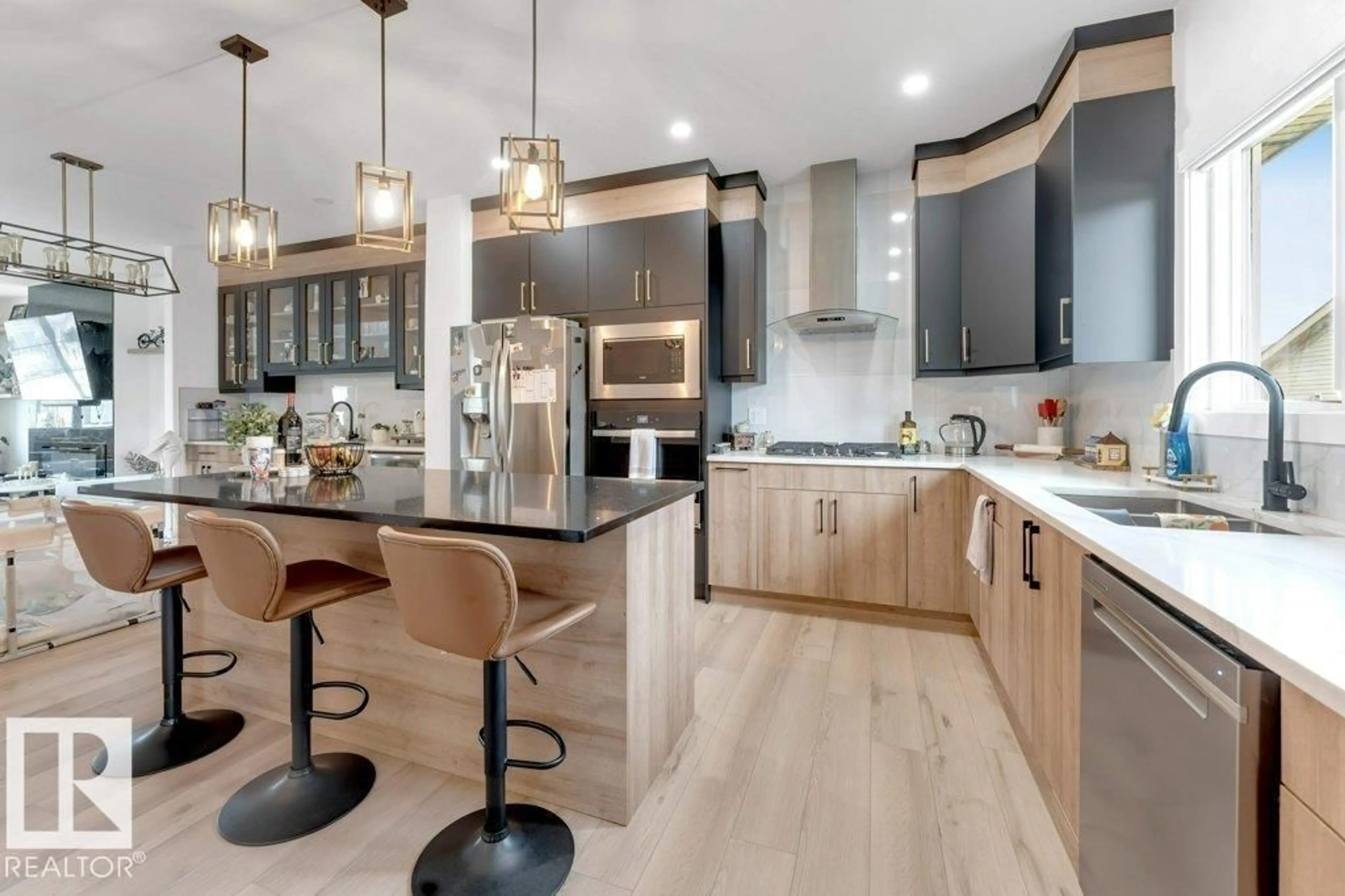 Open concept kitchen, wood/laminate floor for 4201 38 ST, Beaumont Alberta T4X3B3