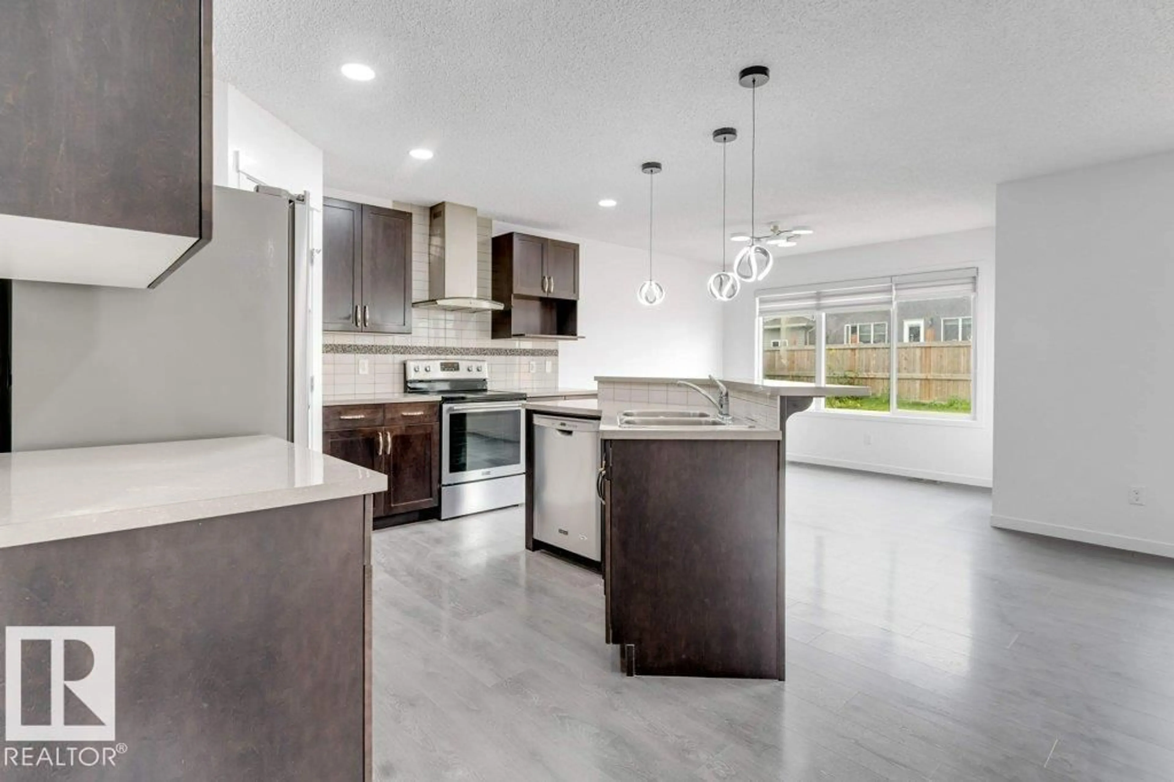Open concept kitchen, ceramic/tile floor for 3007 13 AV, Edmonton Alberta T6T0Z3
