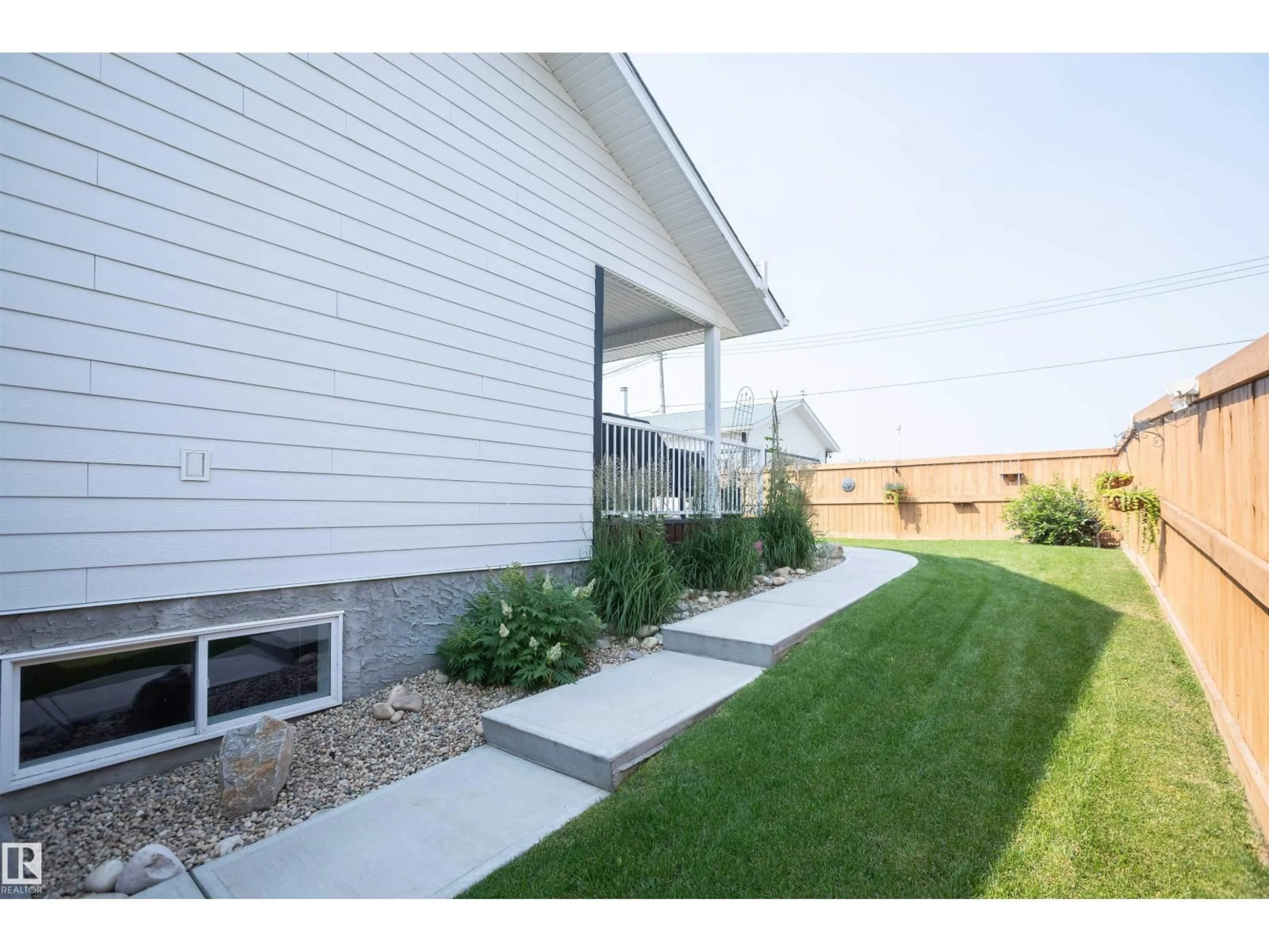 Home with vinyl exterior material, street for 5404 60TH STREET, Barrhead Alberta T7N1C1