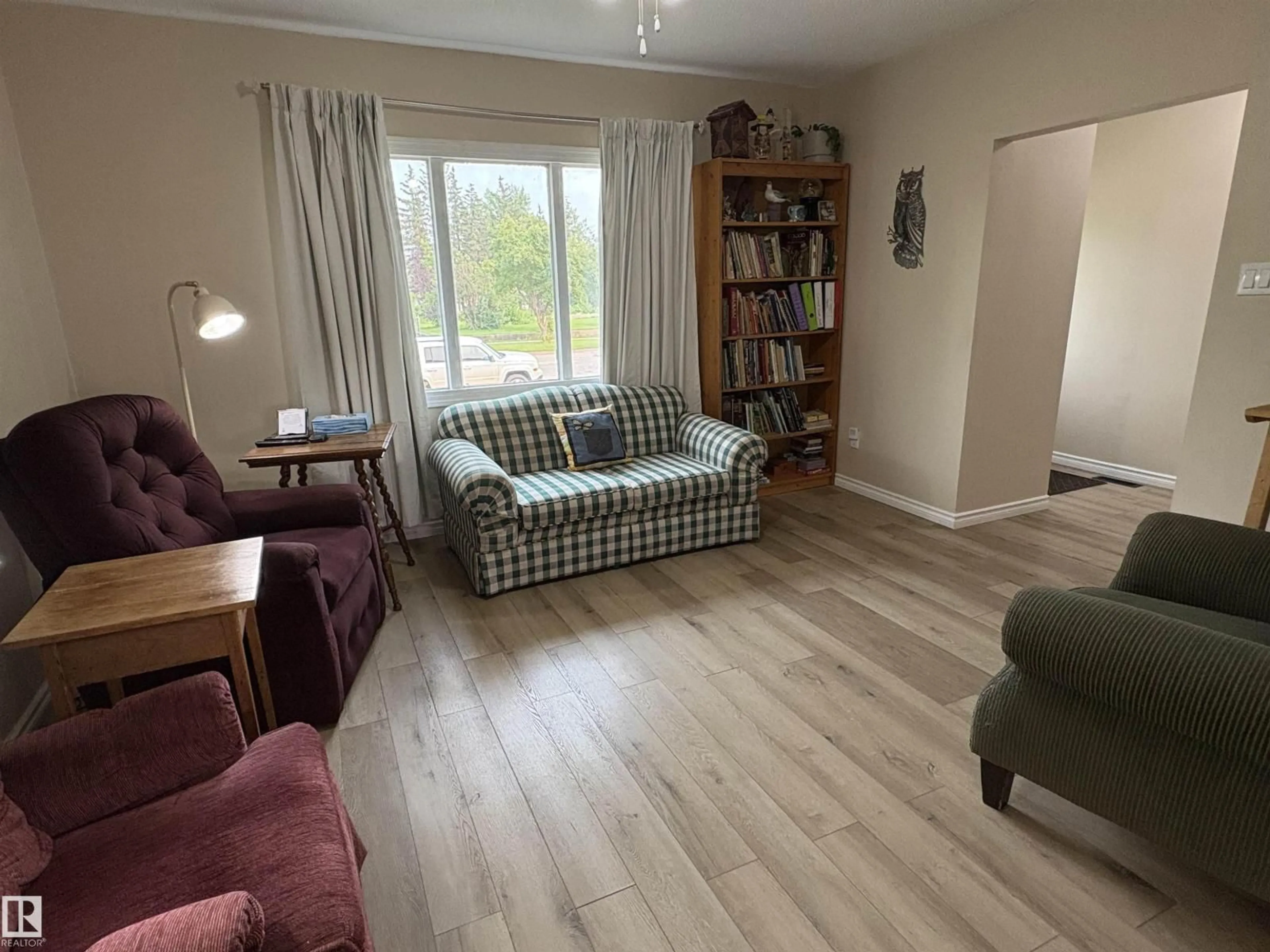 Living room with furniture, wood/laminate floor for 5308 50 ST, Ryley Alberta T0B4A0