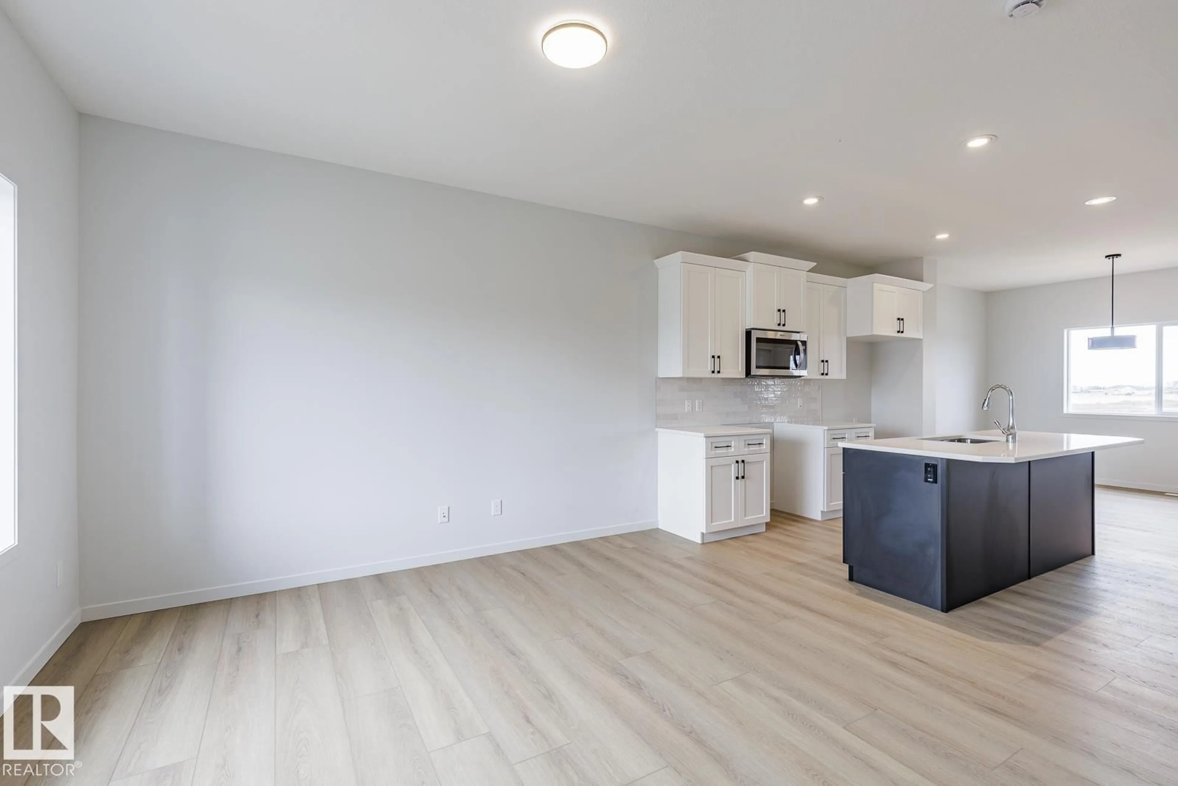 Open concept kitchen, wood/laminate floor for 3603 40 AV, Beaumont Alberta T4X2Y3
