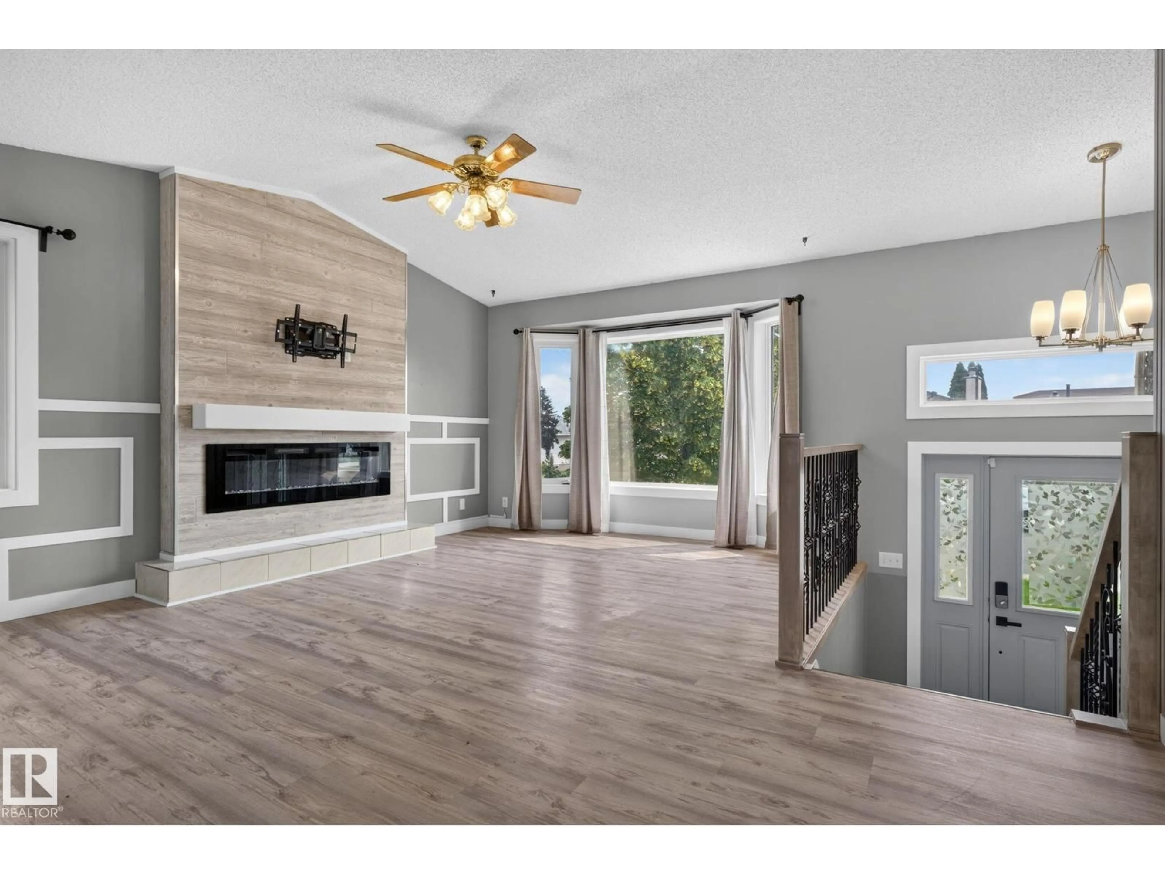 Living room with furniture, wood/laminate floor for 9530 174 AV, Edmonton Alberta T5Z2B3
