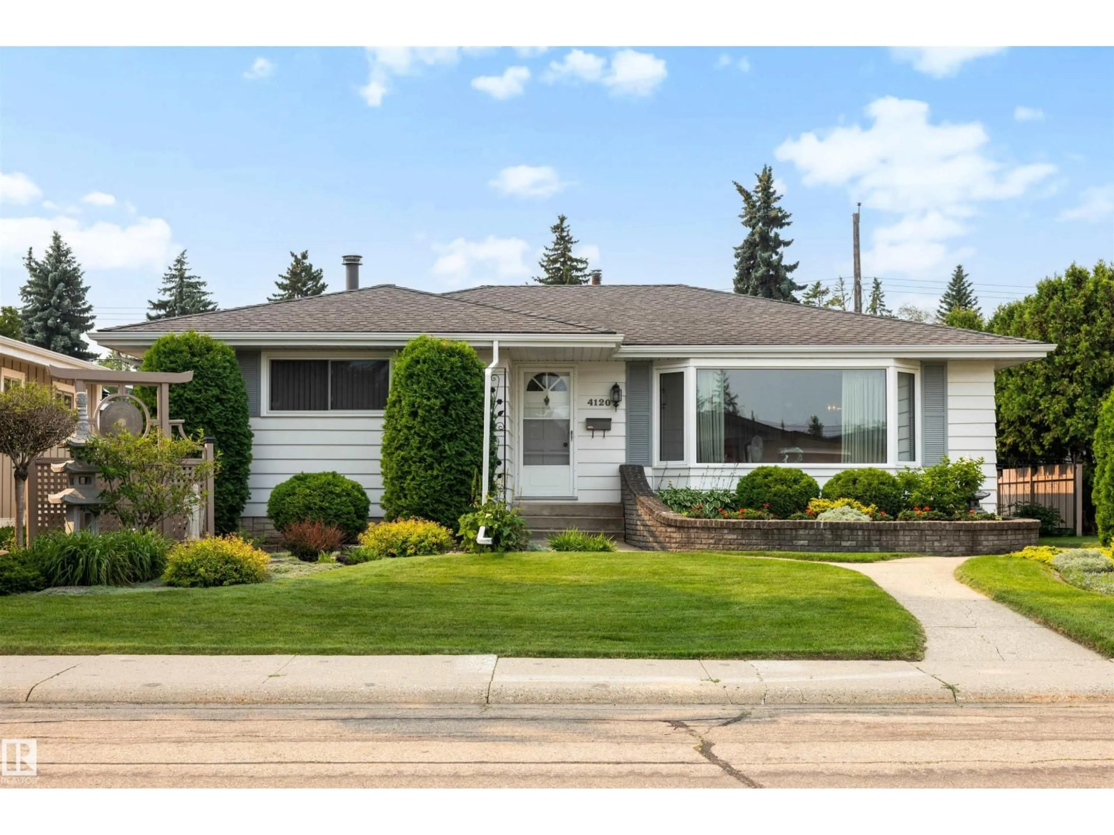 Home with vinyl exterior material, street for 4120 120 ST, Edmonton Alberta T6J1Y1