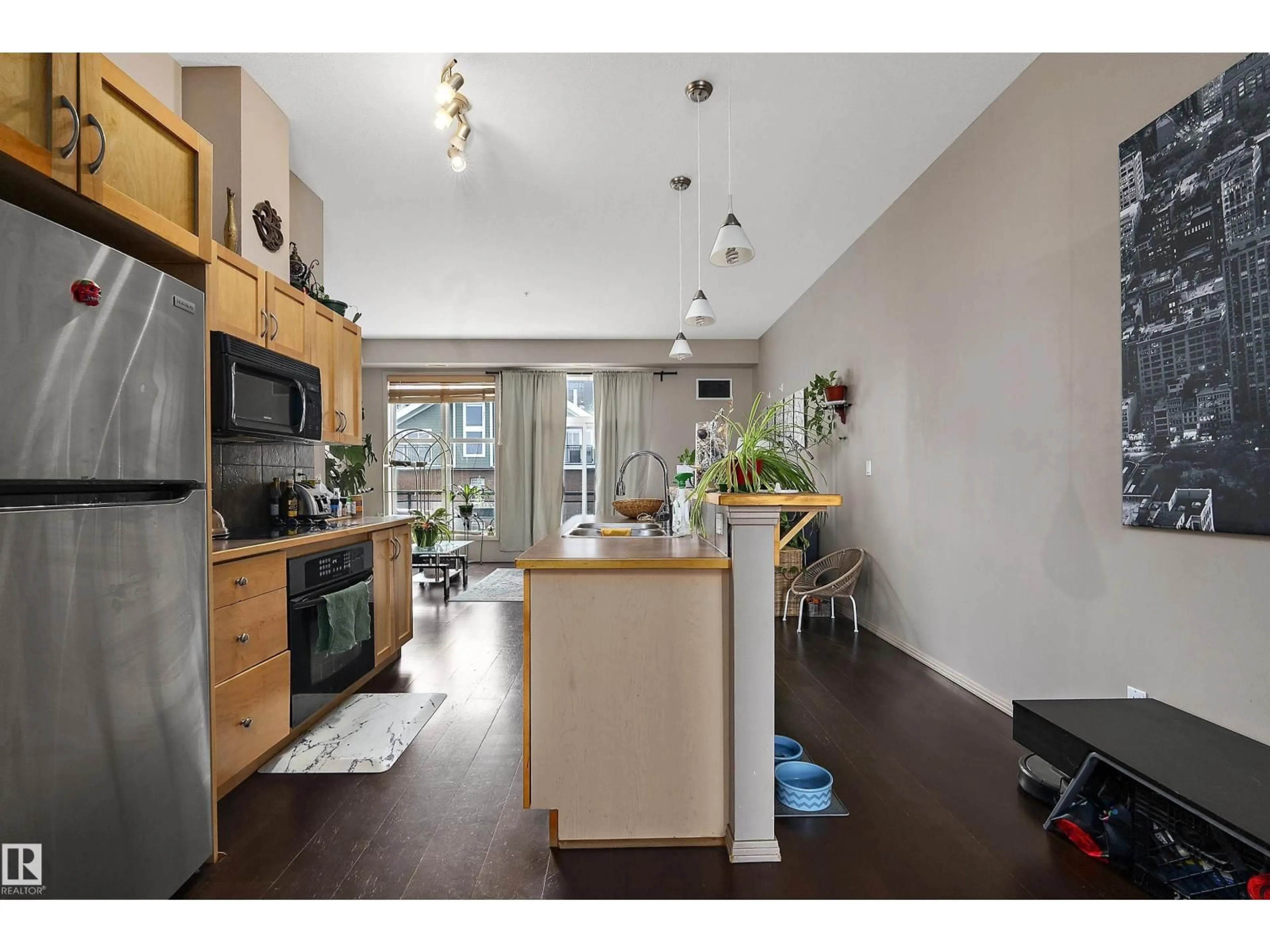 Open concept kitchen, wood/laminate floor for NW - 713 10503 98 AV, Edmonton Alberta T5K0B2