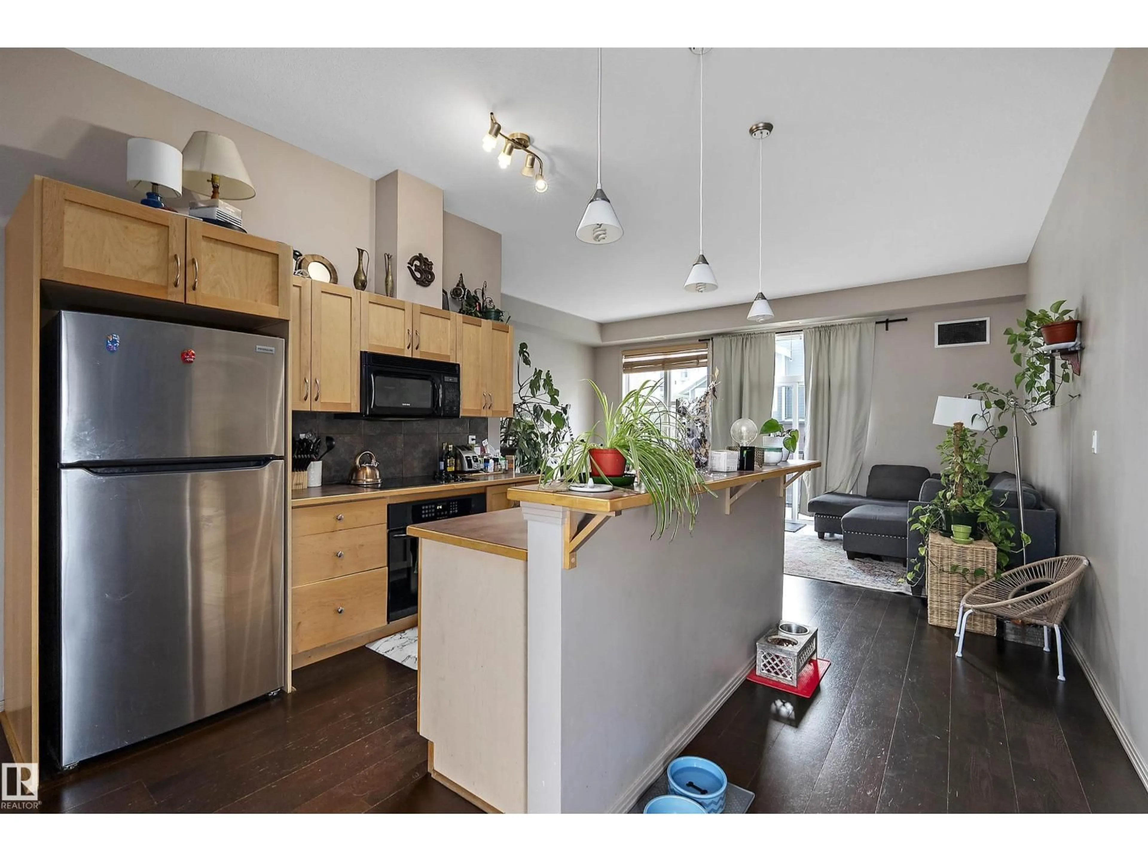 Open concept kitchen, wood/laminate floor for NW - 713 10503 98 AV, Edmonton Alberta T5K0B2