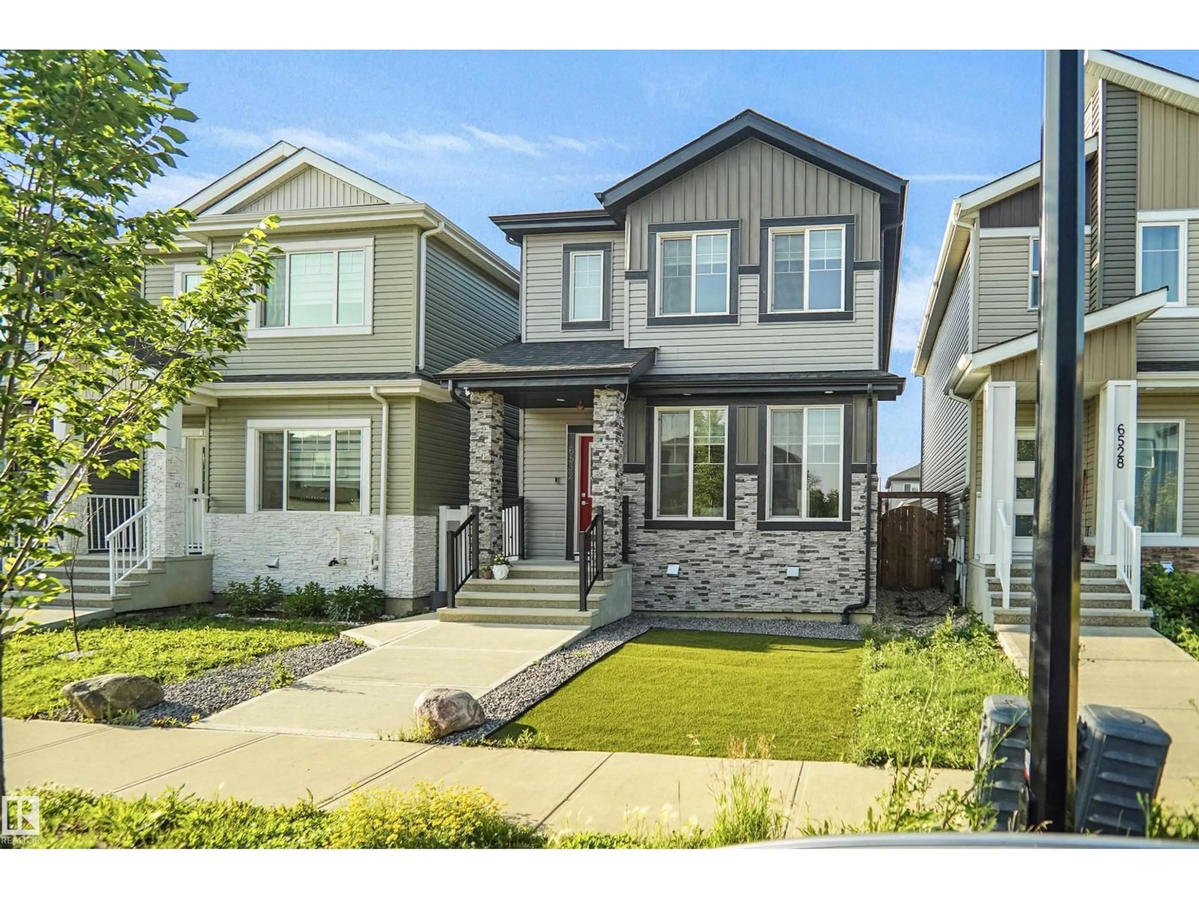 Home with vinyl exterior material, street for NW - 6532 175 AV, Edmonton Alberta T5Y4B3