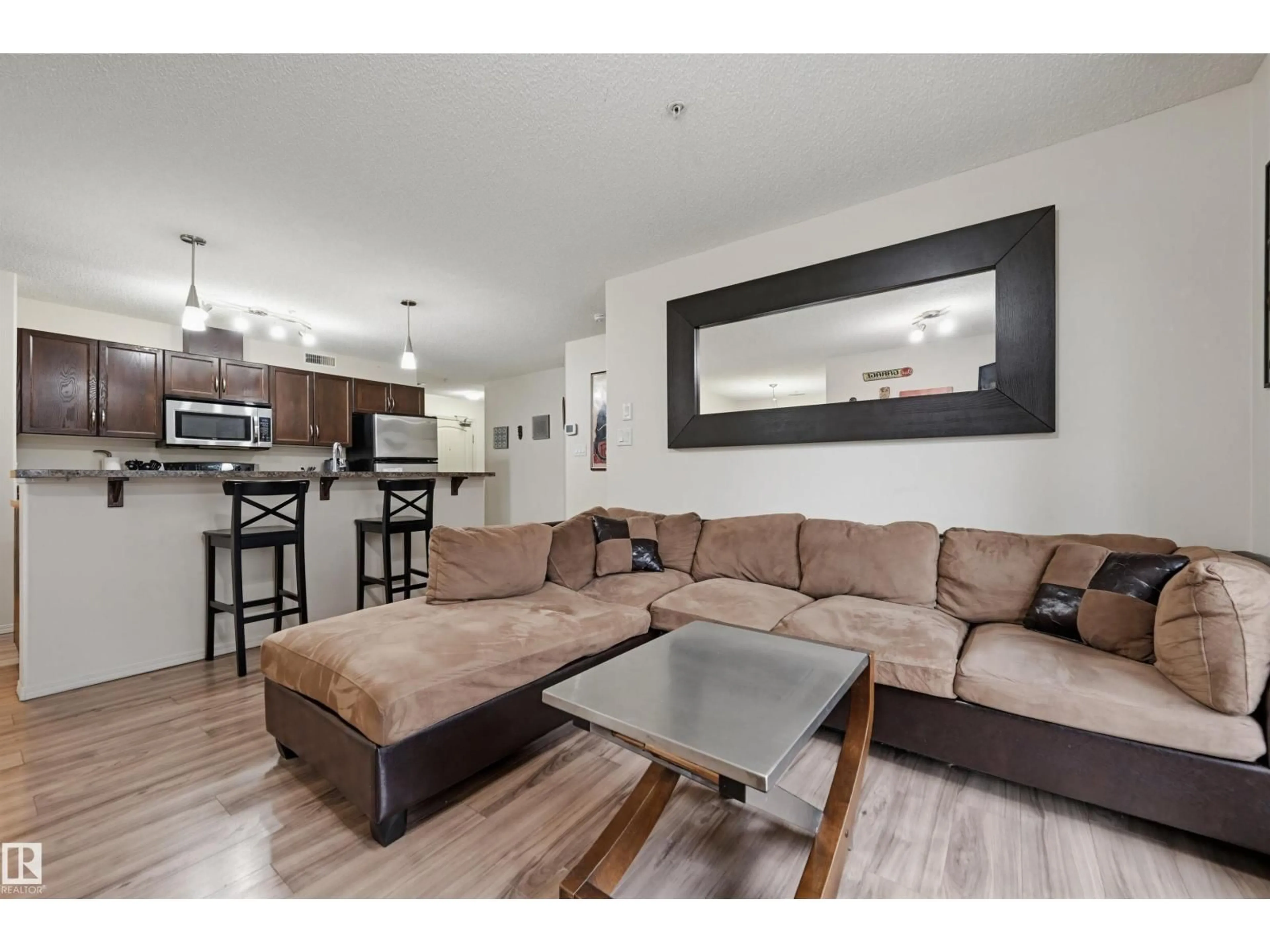 Living room with furniture, wood/laminate floor for #121 - 17415 99 AV, Edmonton Alberta T5T0W8