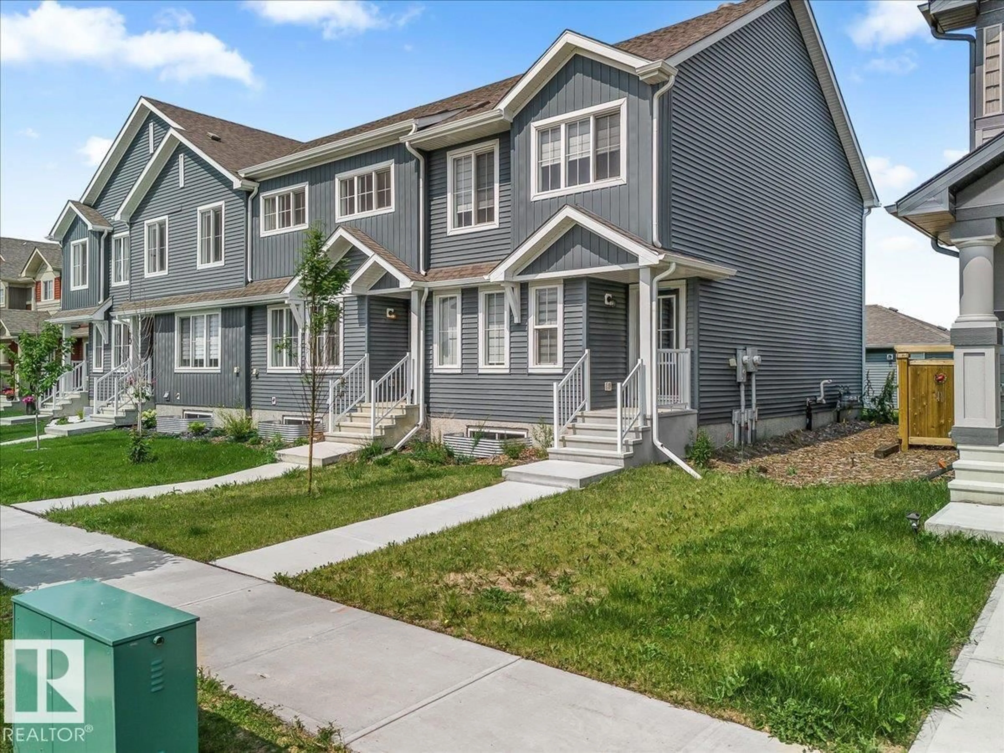 Home with vinyl exterior material, street for 12 ELLIOT WD, Fort Saskatchewan Alberta T8L0Z4