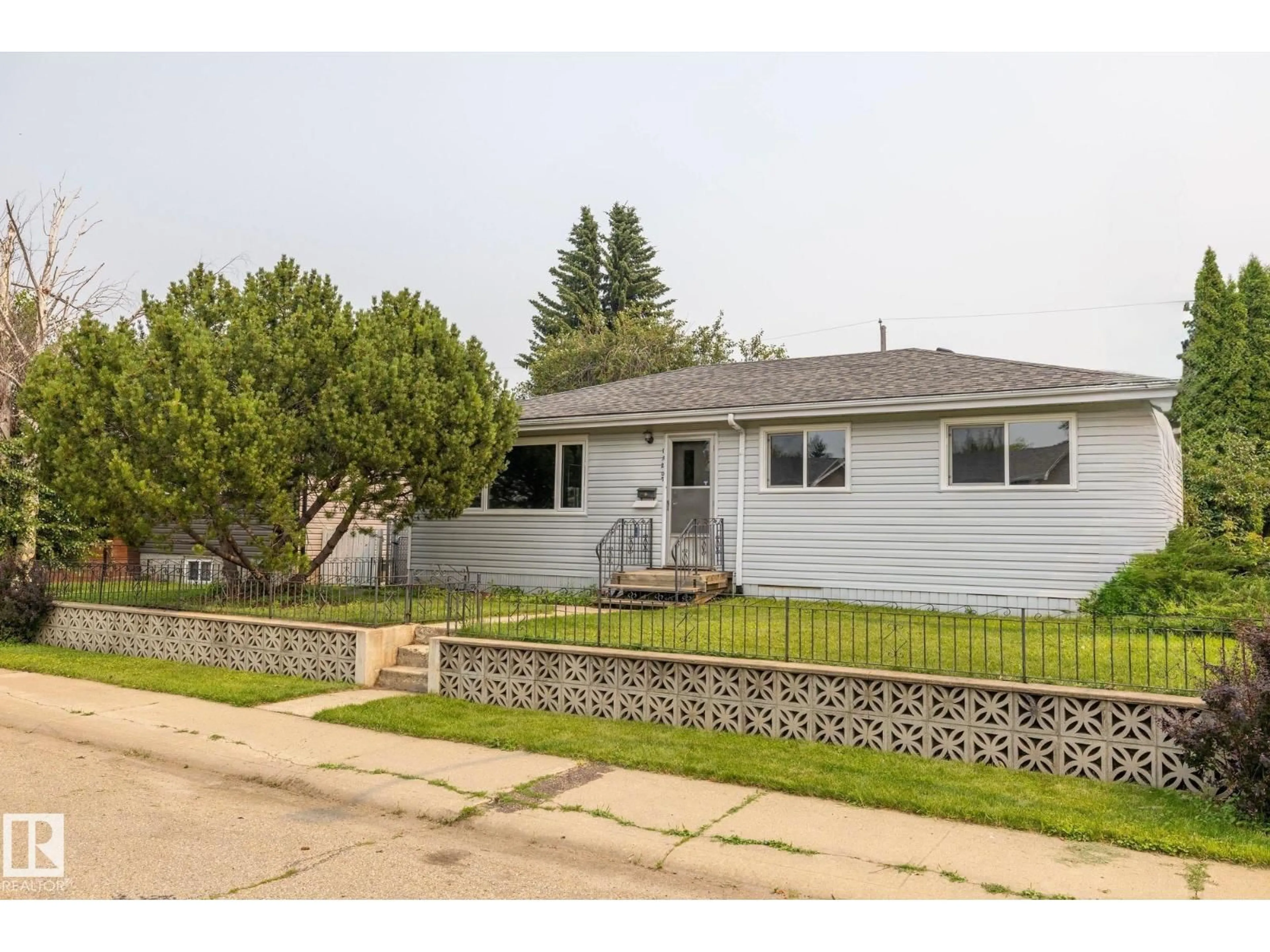 Home with vinyl exterior material, street for NW - 13207 77 ST, Edmonton Alberta T5C1C8