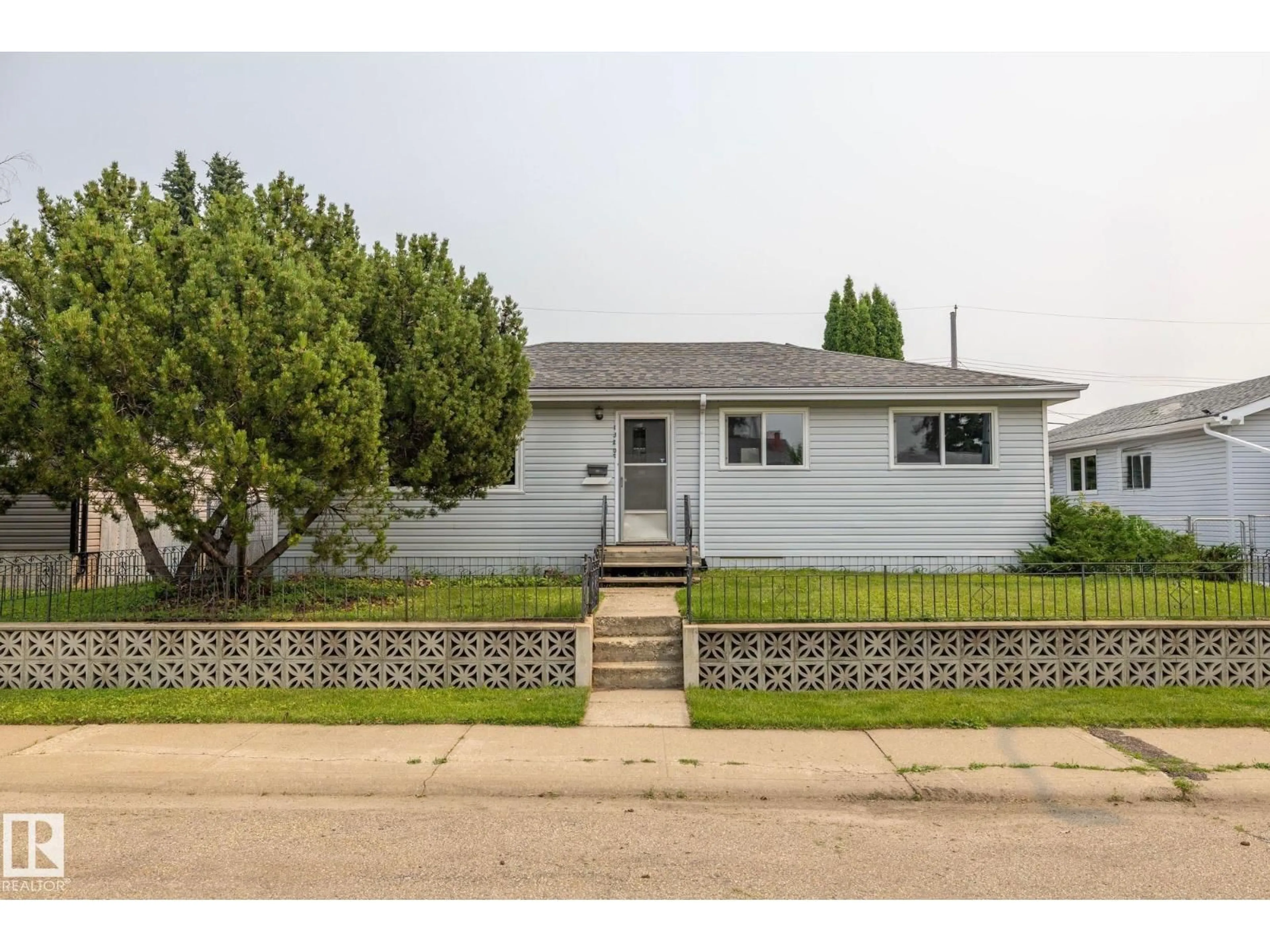 Home with vinyl exterior material, street for NW - 13207 77 ST, Edmonton Alberta T5C1C8