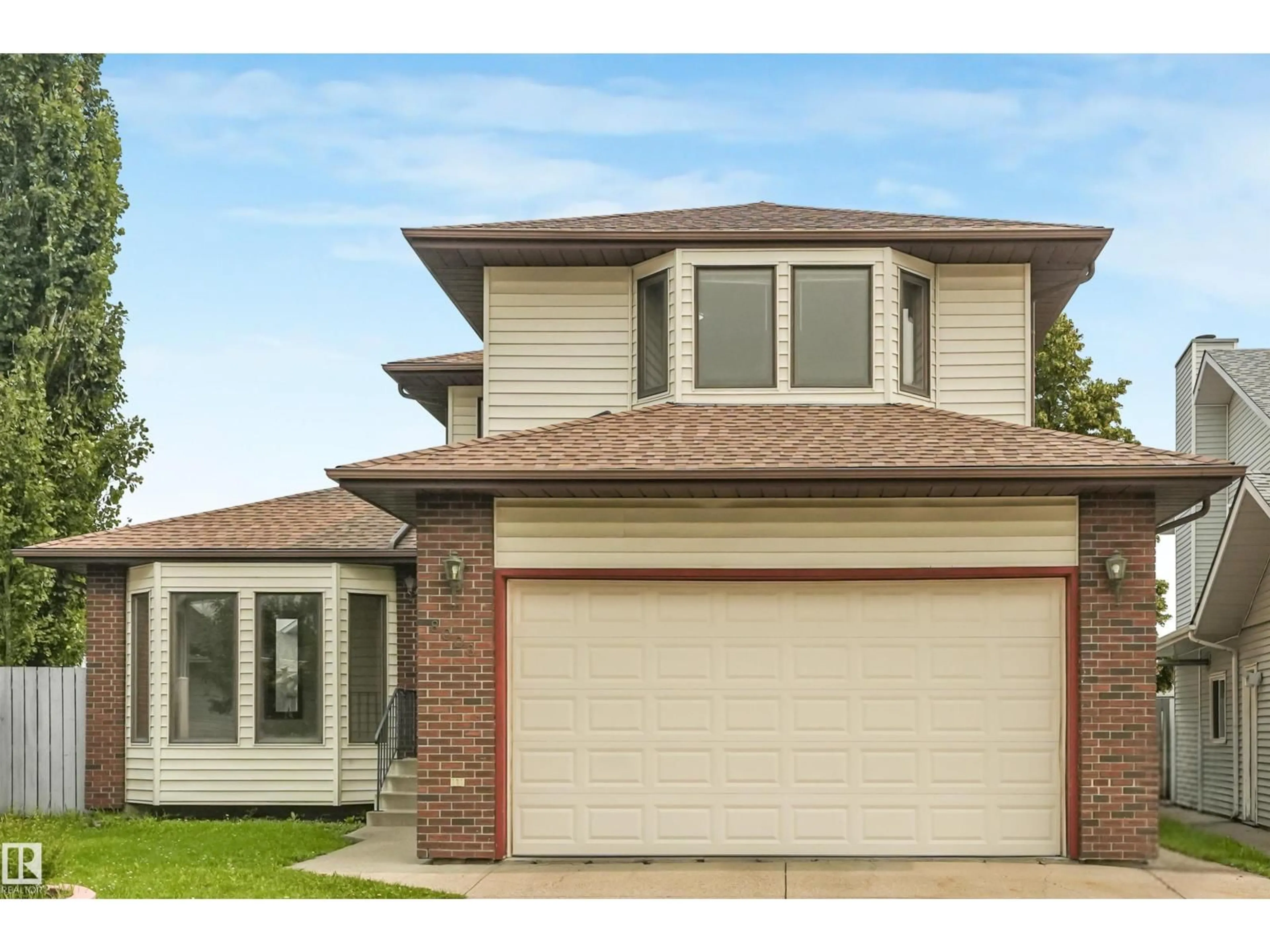Home with brick exterior material, street for 8008 158 AV, Edmonton Alberta T5Z2T7