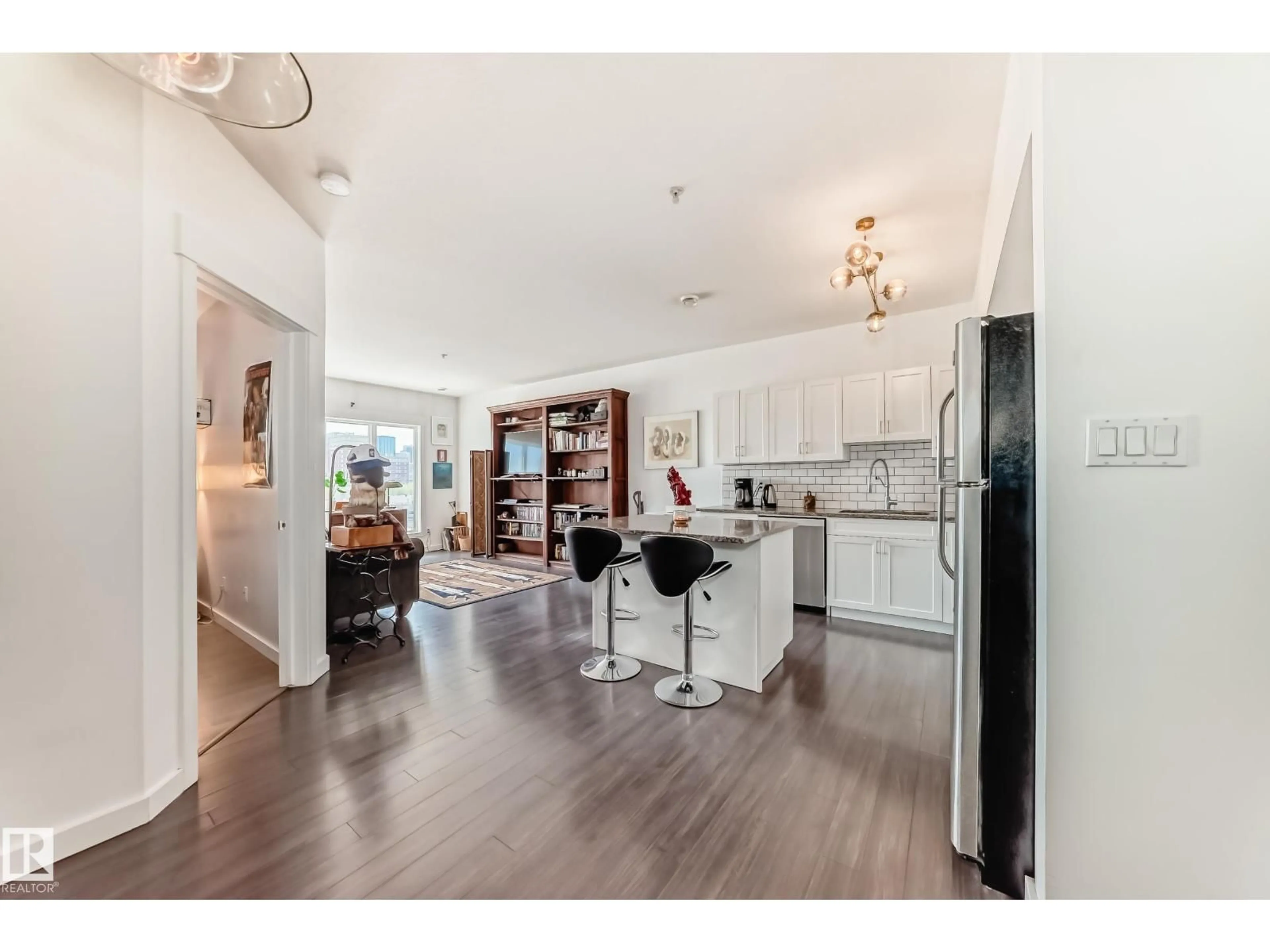 Open concept kitchen, wood/laminate floor for 316 10518 113 ST NW, Edmonton Alberta T5H0C6
