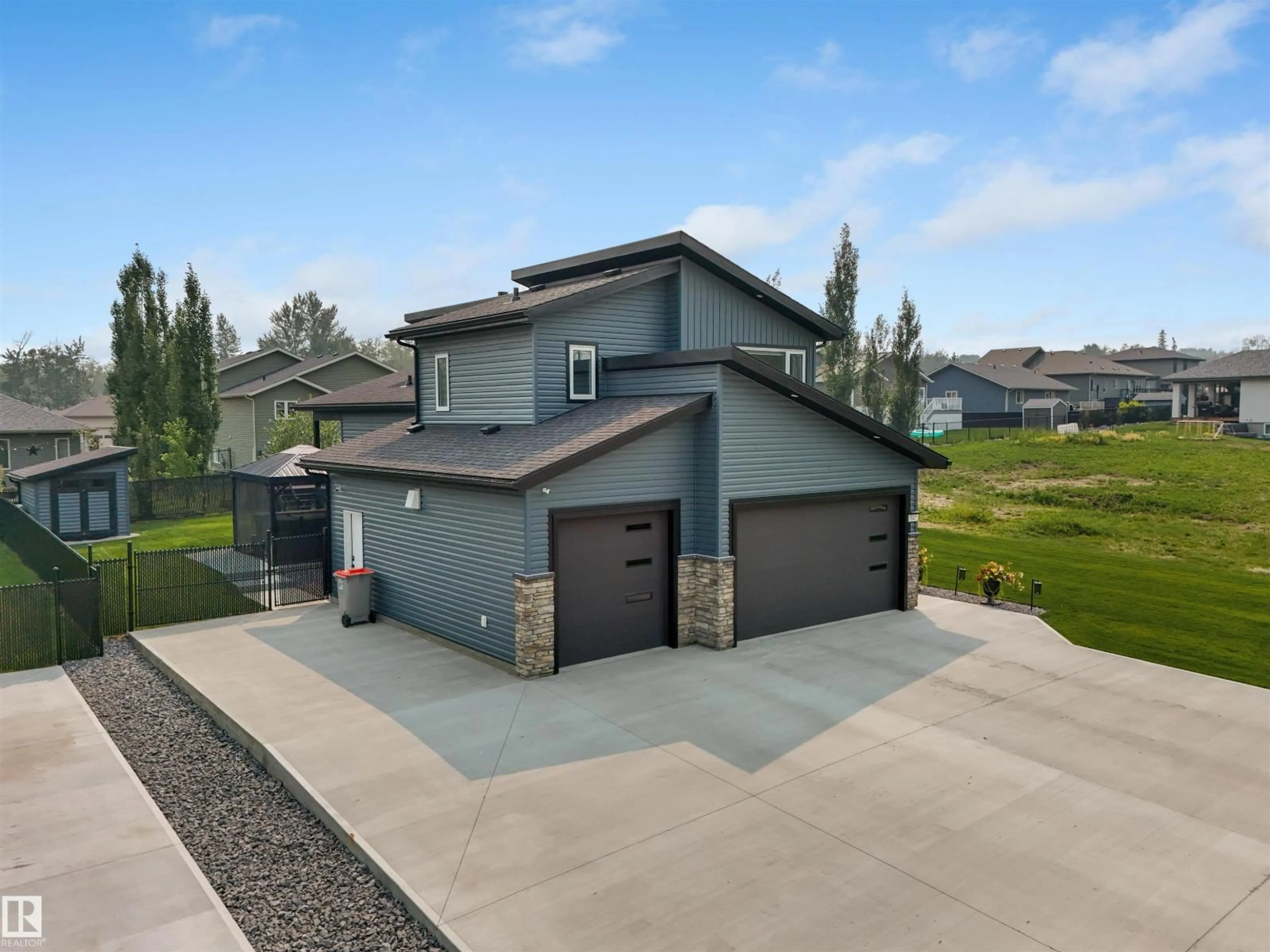 A pic from outside/outdoor area/front of a property/back of a property/a pic from drone, street for 517 - 49119 RGE ROAD 73, Rural Brazeau County Alberta T7A1B9