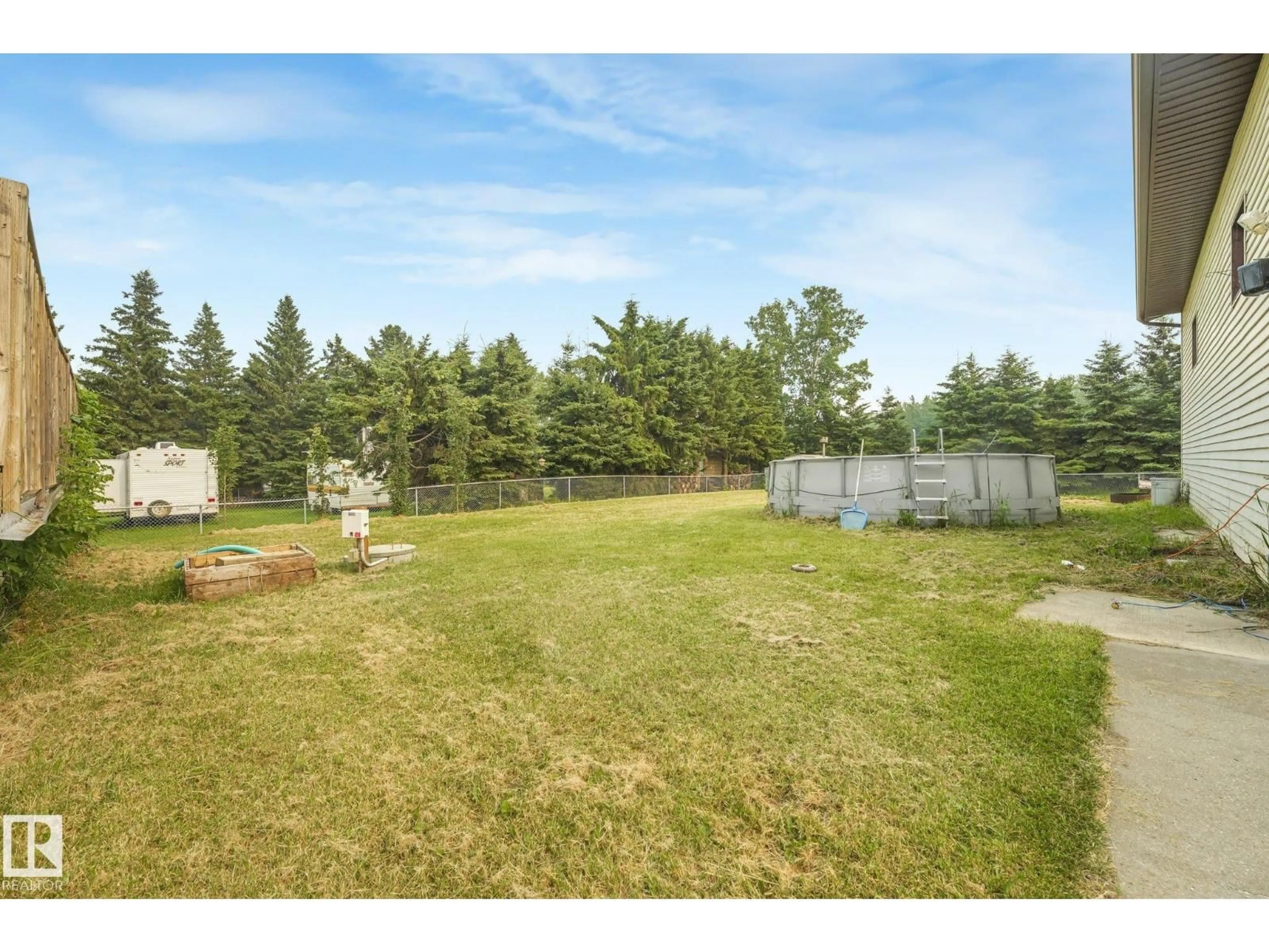 A pic from outside/outdoor area/front of a property/back of a property/a pic from drone, forest/trees view for 54 BUSKMOSE DR, Rural Wetaskiwin County Alberta T0C2V0